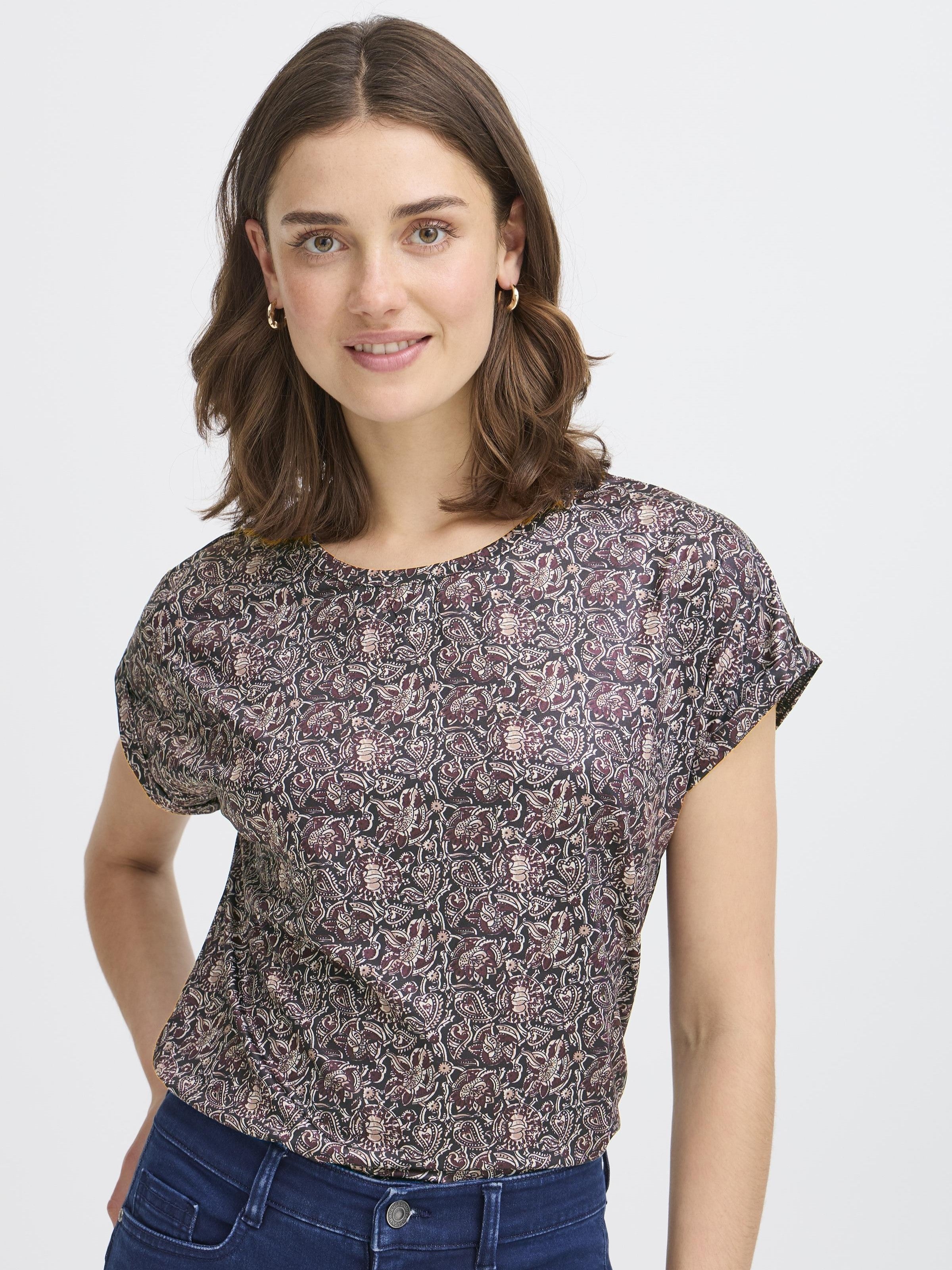 Fransa Seen Short Sleeve Crew Neck Top in a dark floral pattern, styled with casual blue denim jeans by Fransa