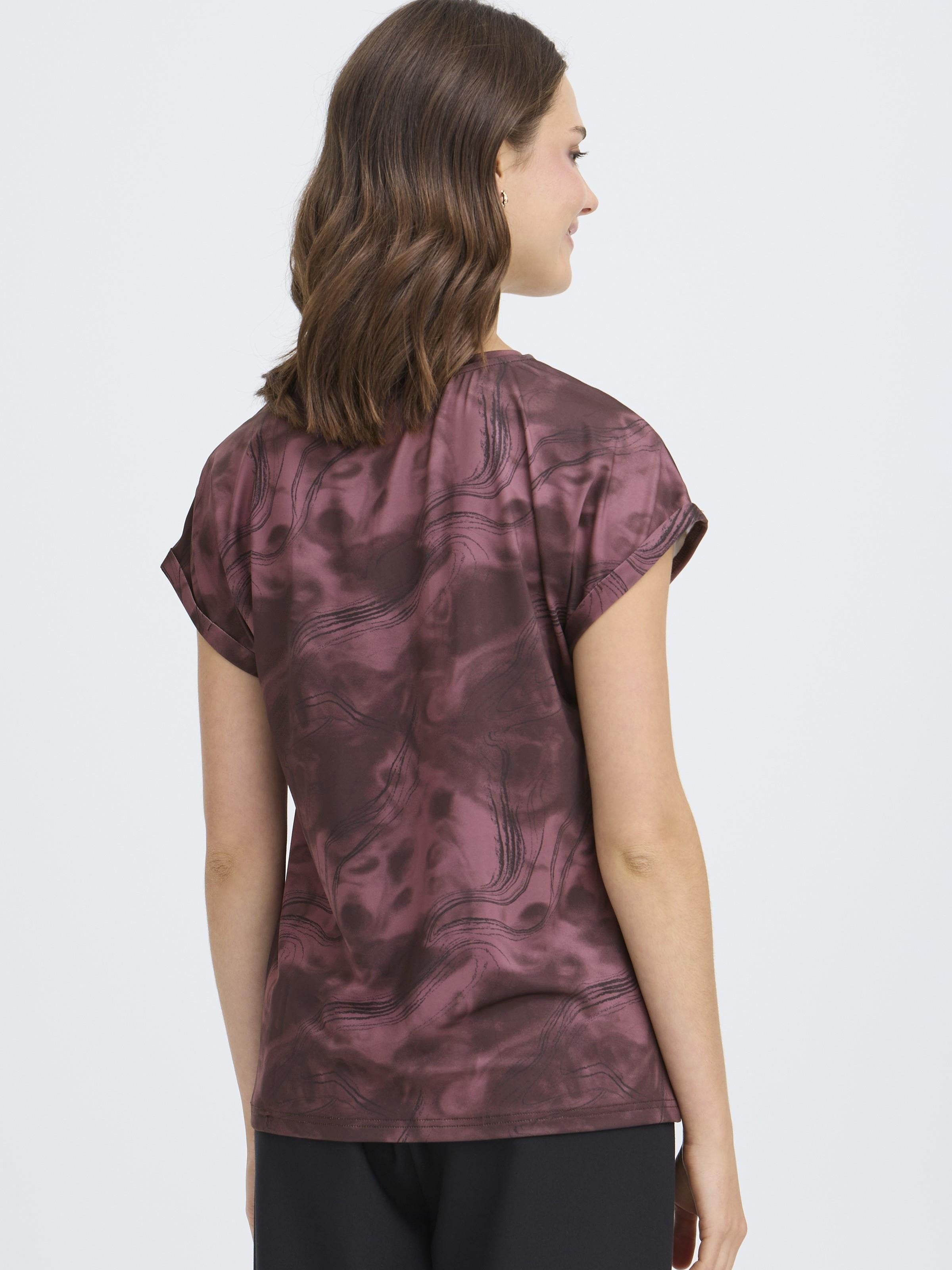 Fransa Seen Short Sleeve Crew Neck Top in burgundy with subtle abstract pattern, styled with black bottoms.