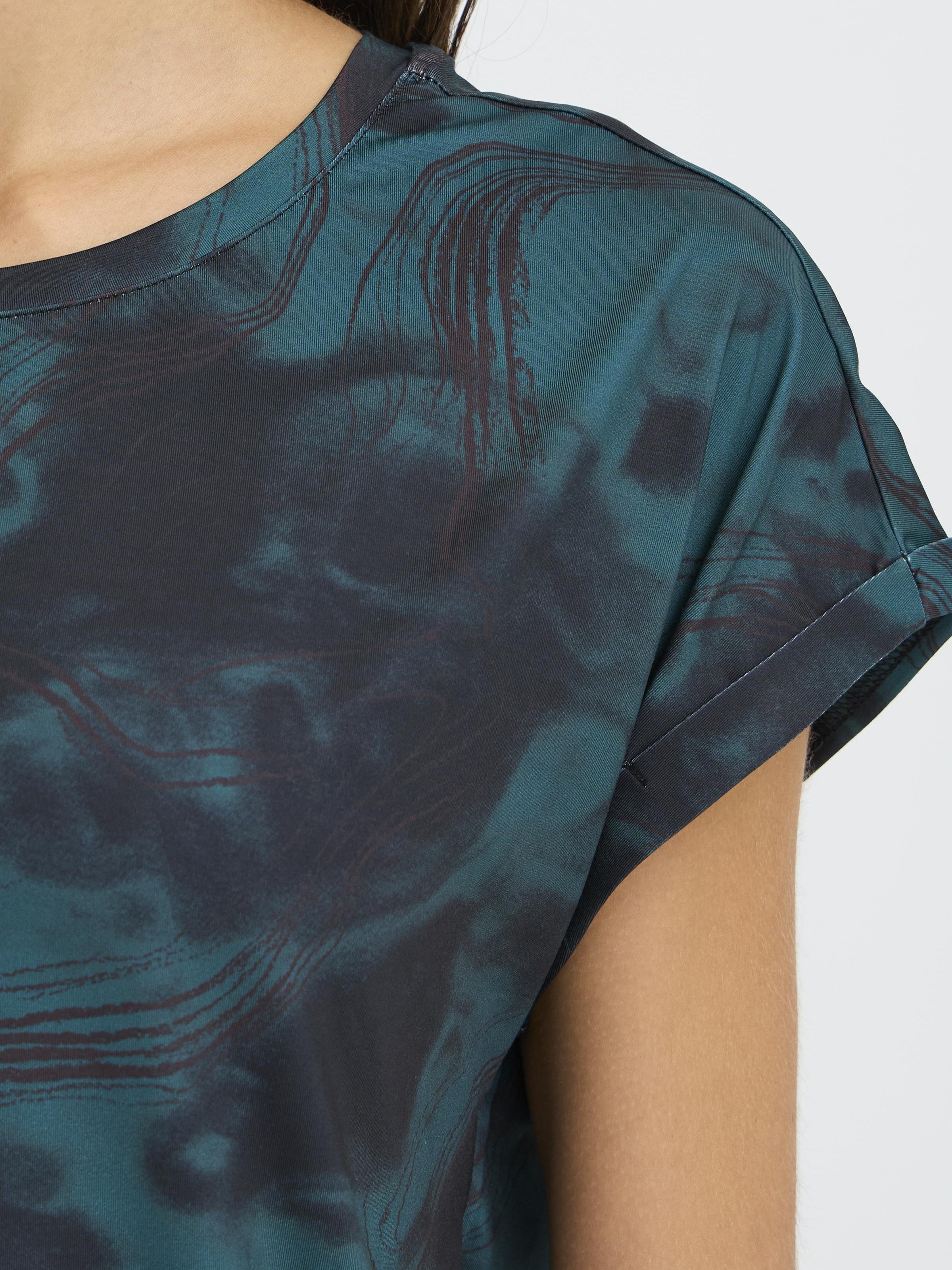Close-up of dark green patterned Fransa Seen Short Sleeve Crew Neck Top sleeve and neckline by Fransa