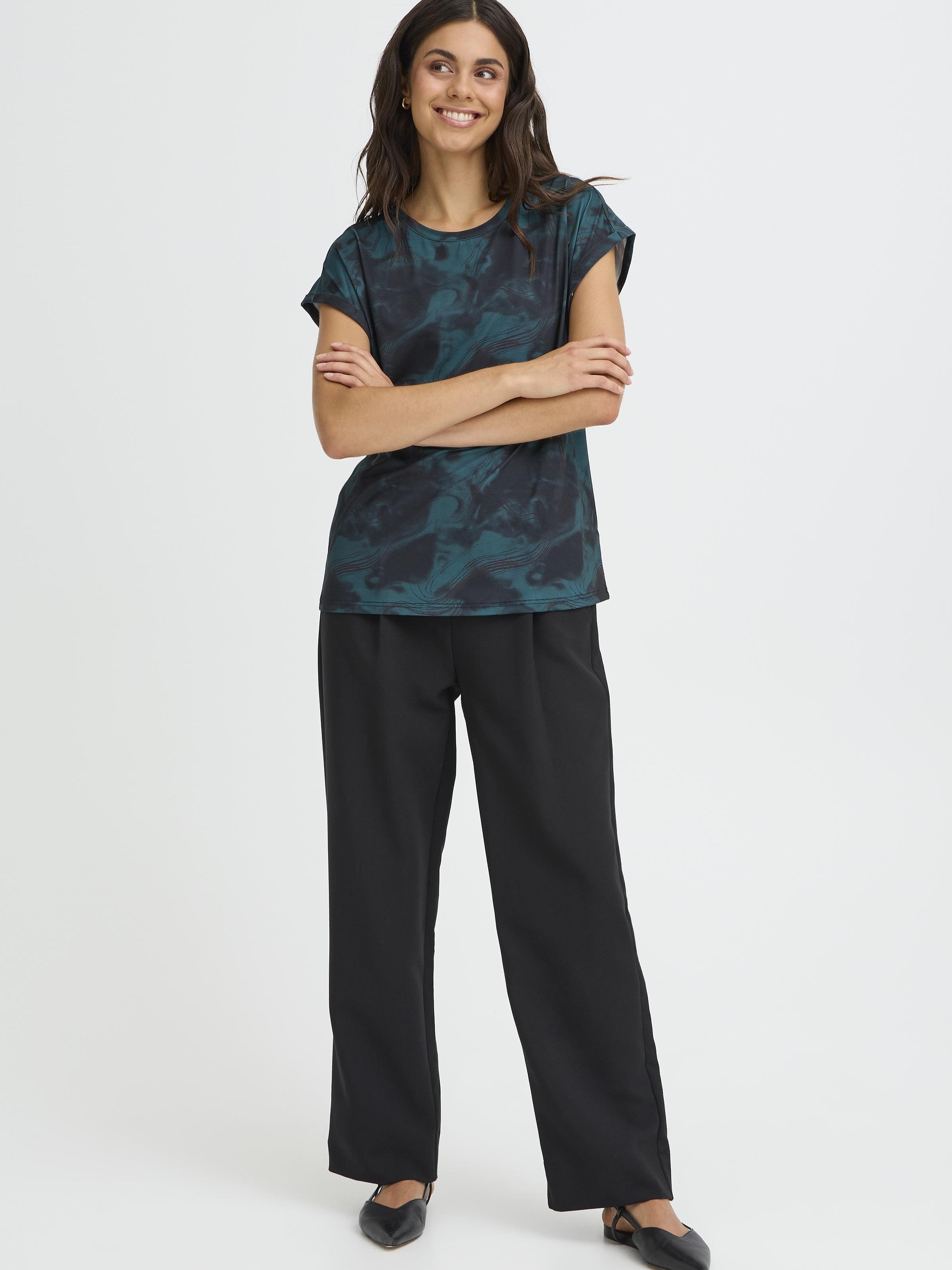Fransa Seen Short Sleeve Crew Neck Top in dark green patterned fabric styled with black wide-leg pants by Fransa
