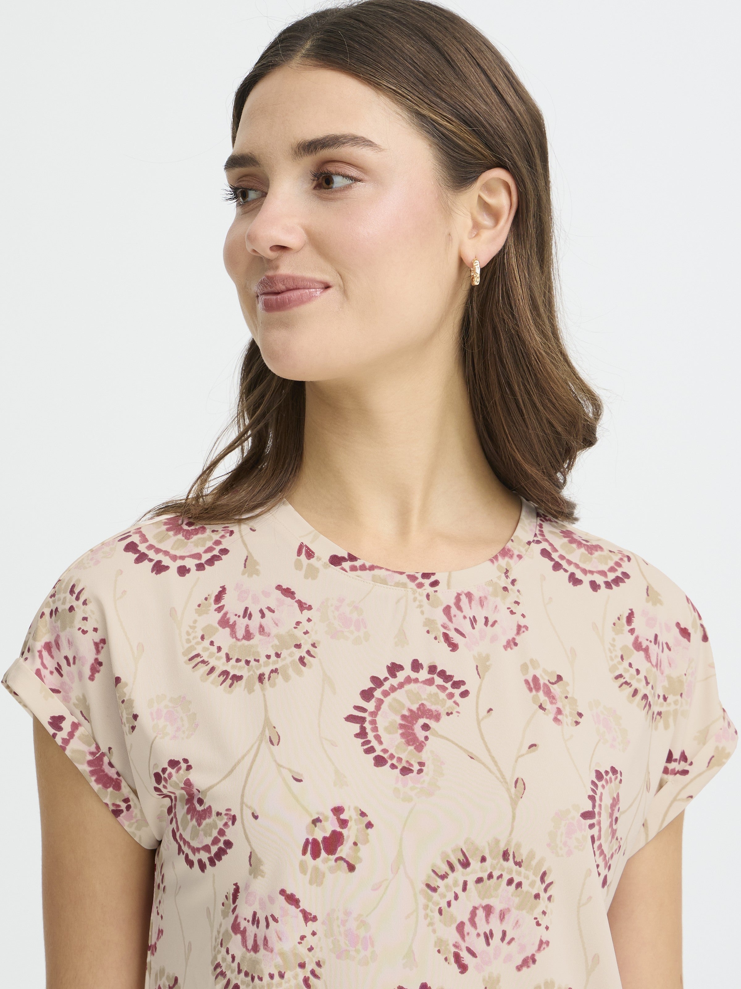 Fransa Seen Short Sleeve Crew Neck Top in soft pink with floral print, styled with small gold hoop earrings