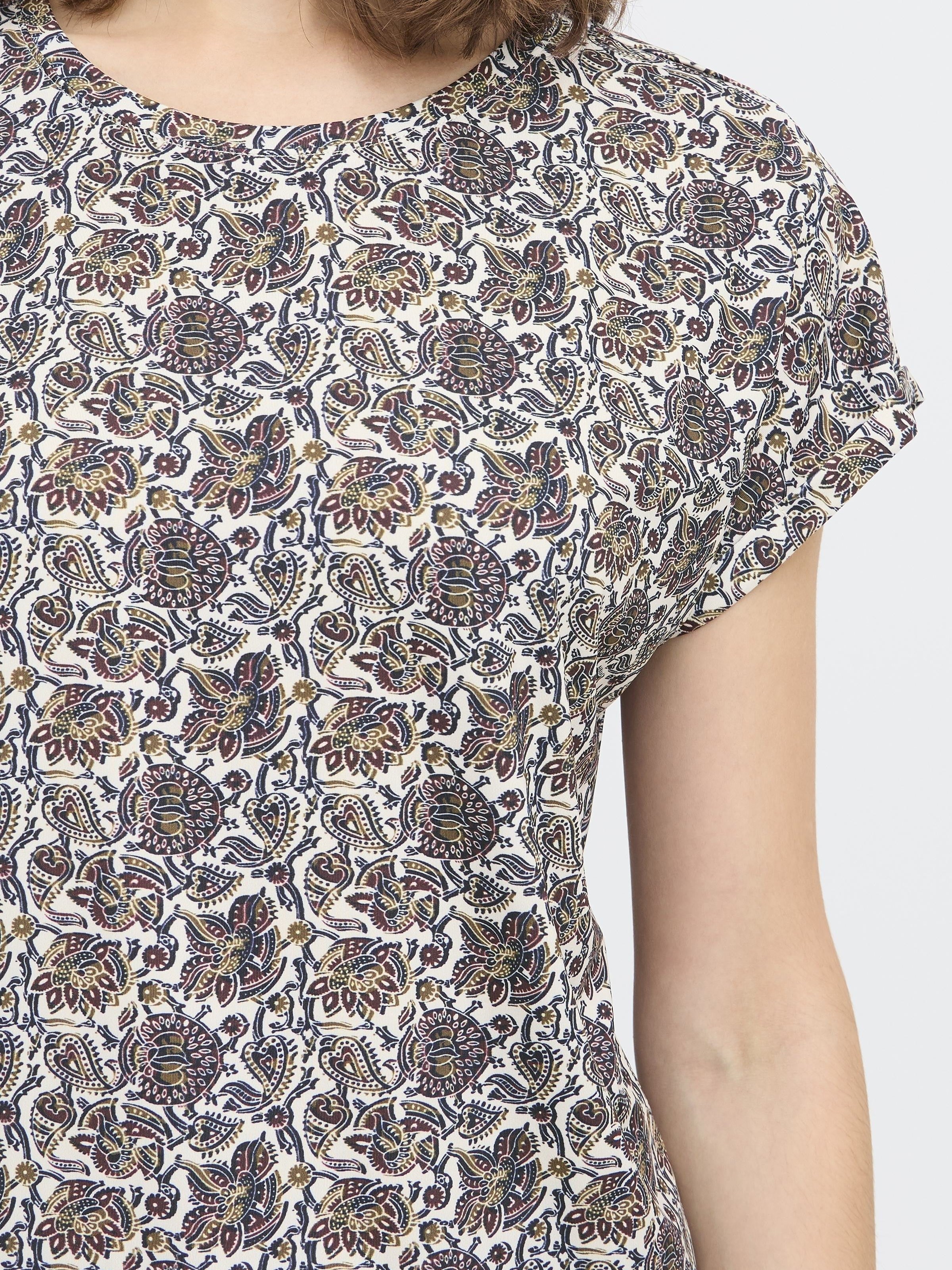 Fransa Seen Short Sleeve Crew Neck Top with intricate floral pattern in muted tones, styled for casual wear.