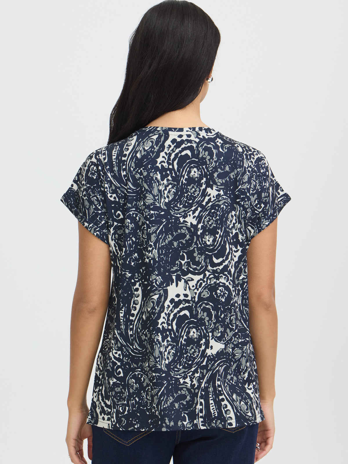 Back view of a navy and white abstract paisley short sleeve top