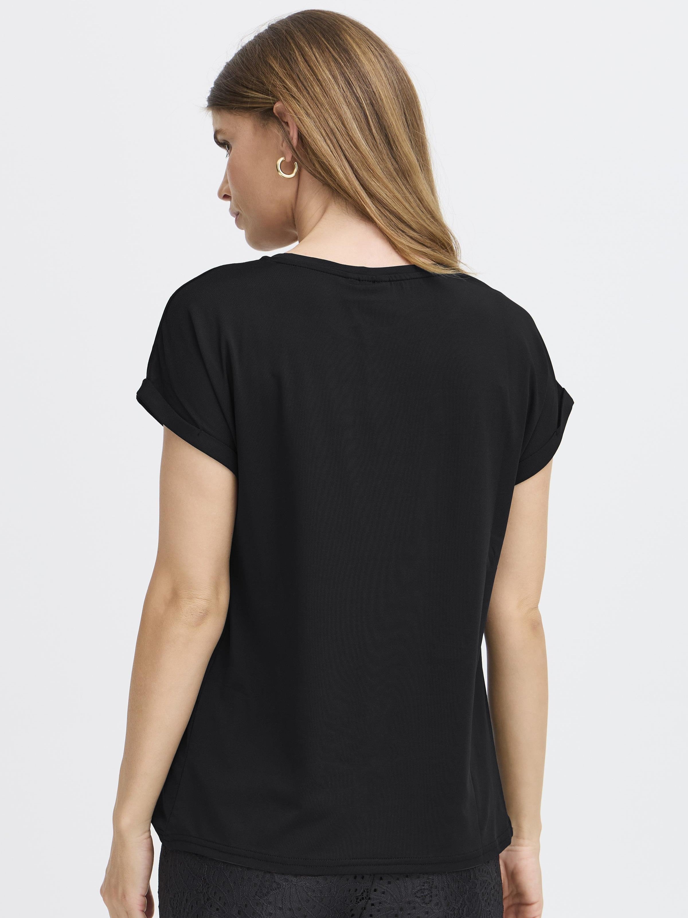 Back view of black Fransa Seen Short Sleeve Crew Neck Top on model with rolled sleeves and gold hoop earrings
