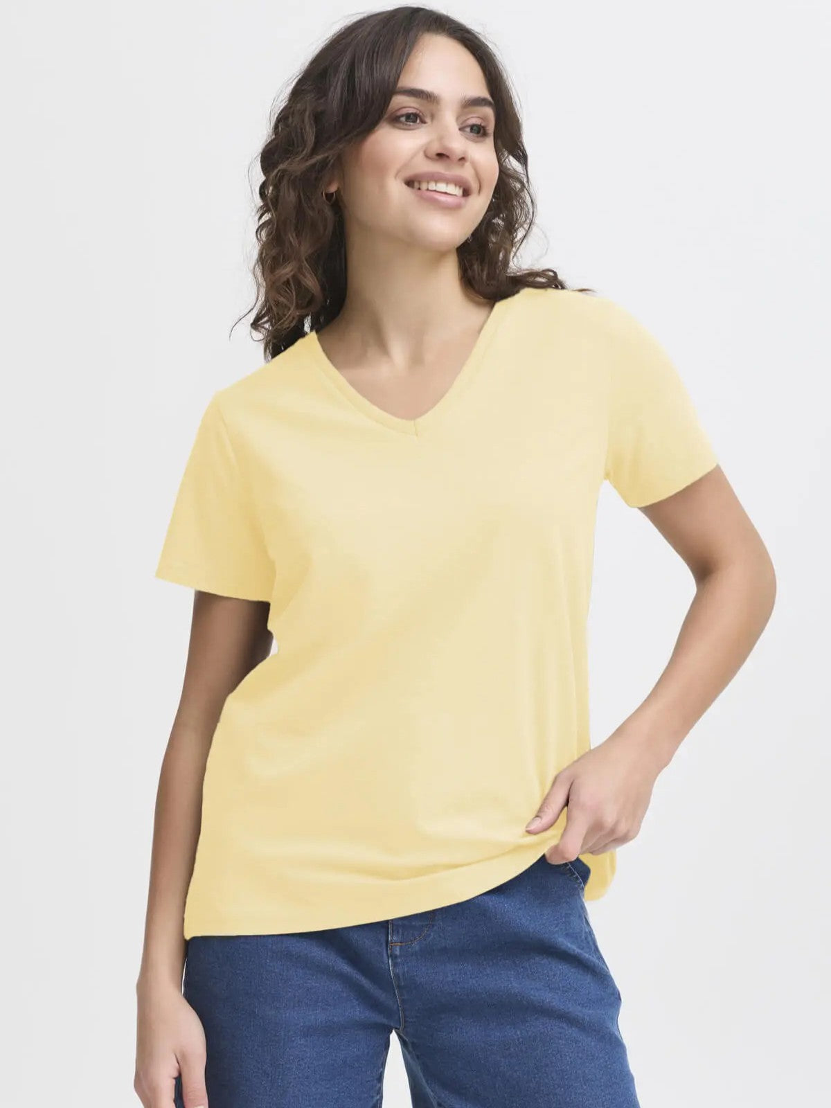 Fransa Shoulder Detail Short Sleeve V-Neck T-Shirt in soft yellow paired with blue denim jeans by Fransa.