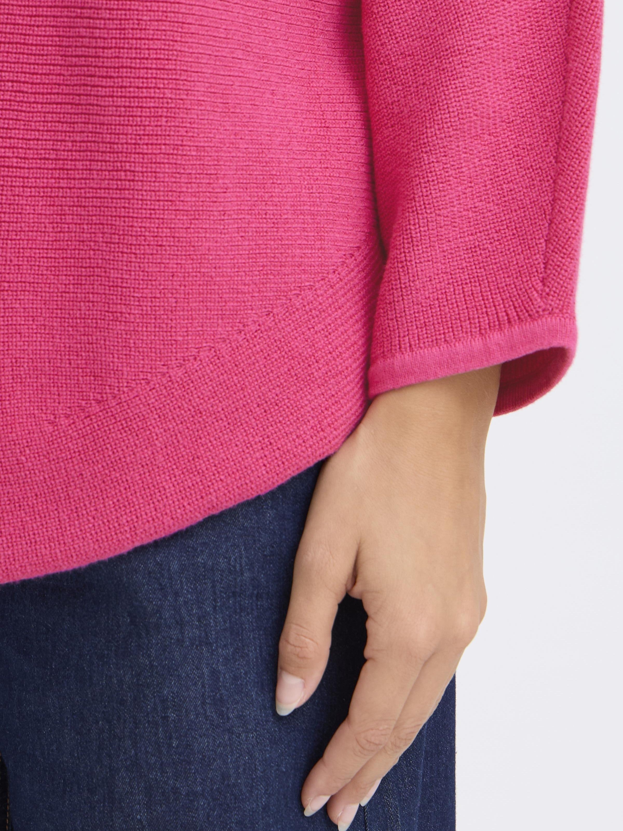 Fransa Sinja Ribbed Crew Neck Knit Top in berry pink with detailed hem and sleeves, paired with dark denim jeans.