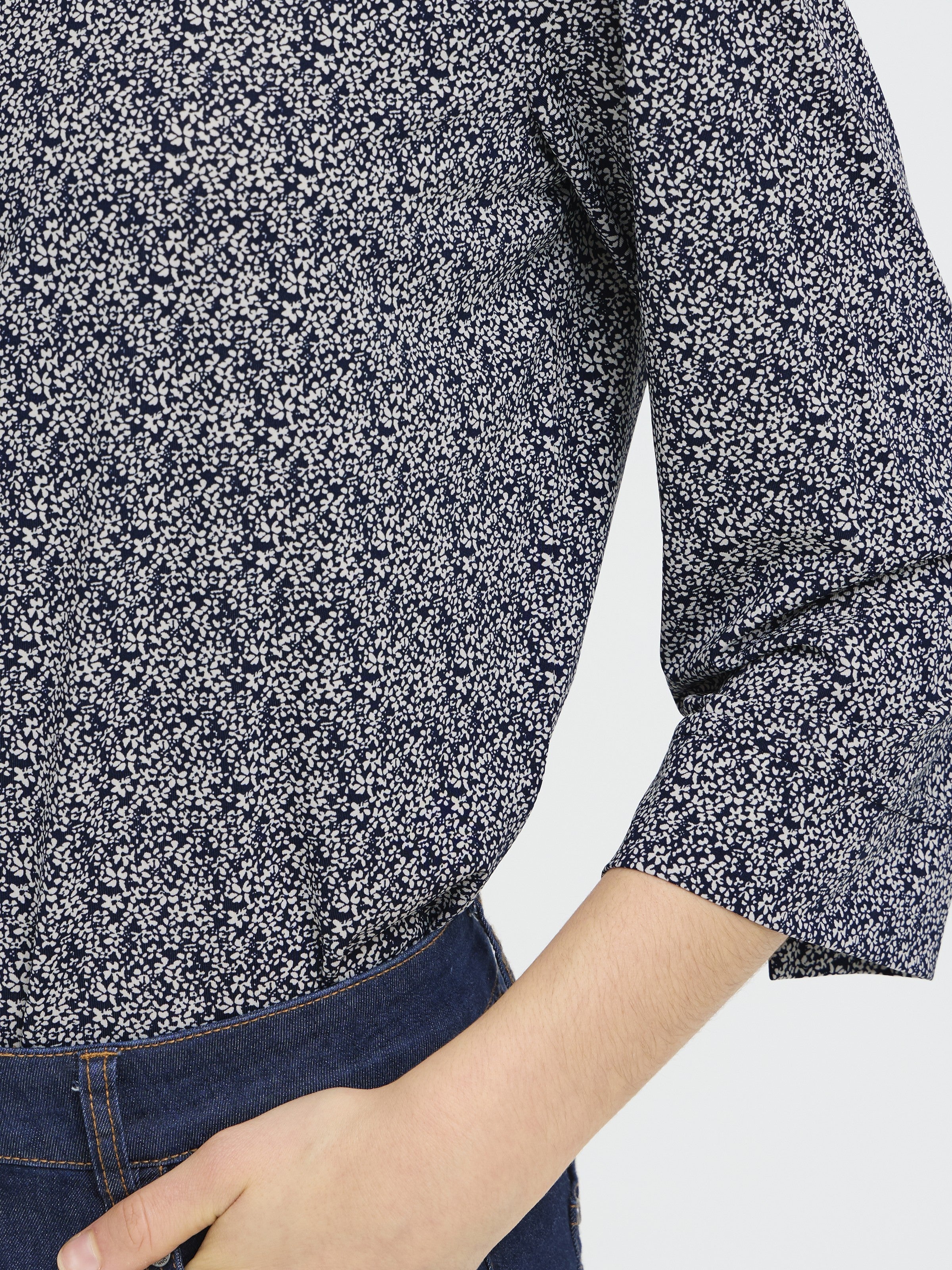 Fransa Seen Three-Quarter Sleeve Cuff Top in navy with white floral pattern paired with dark denim jeans
