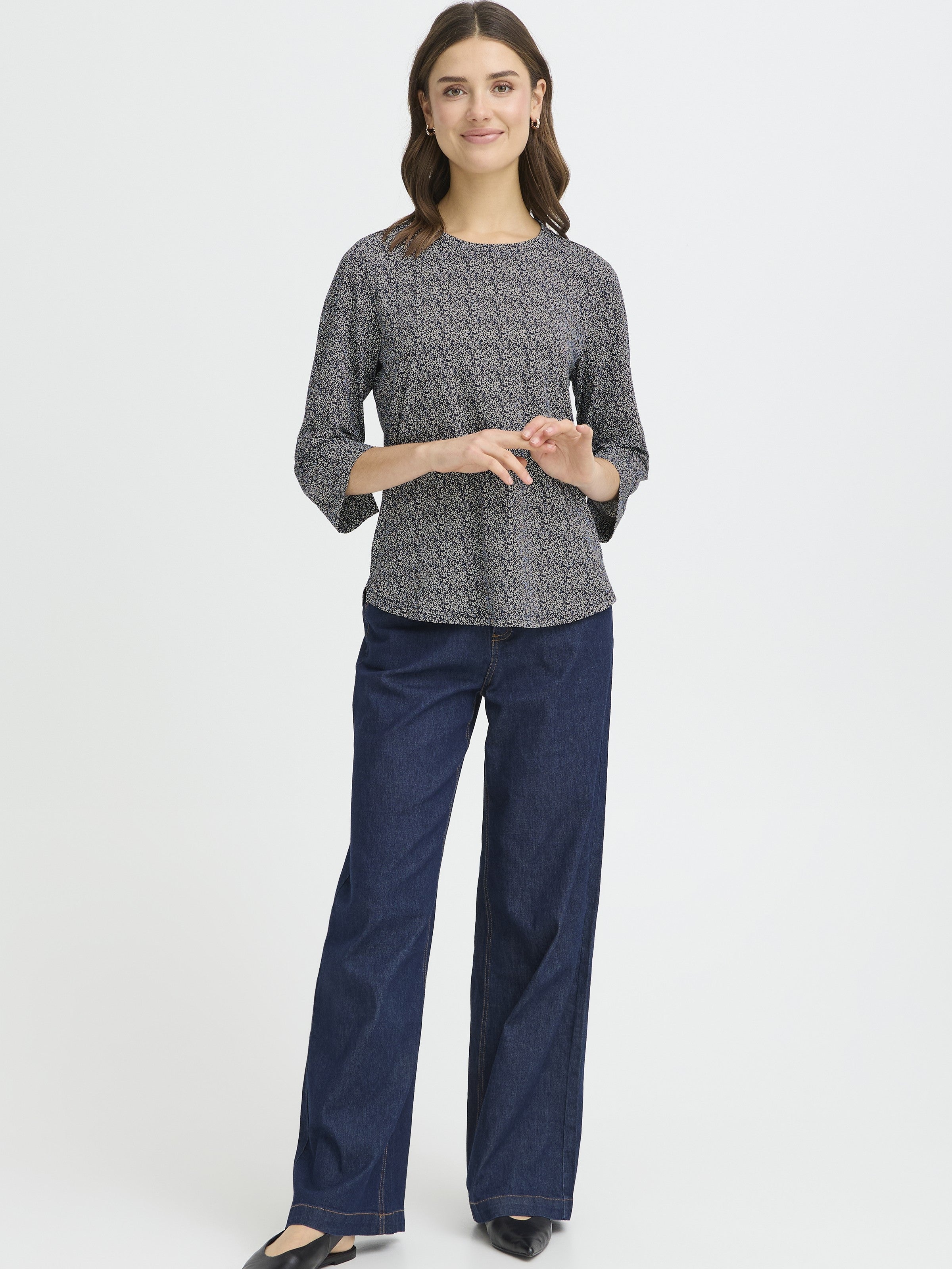 Fransa Seen Three-Quarter Sleeve Cuff Top in patterned navy blue paired with dark wide-leg denim jeans by Fransa.