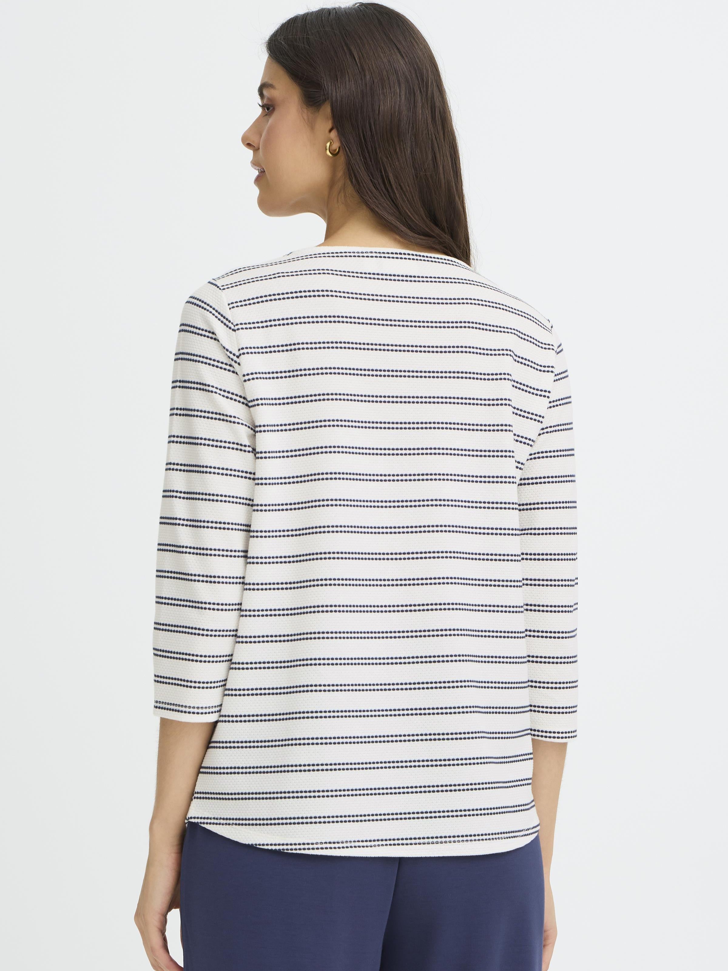 Back view of Fransa Josie Striped Three-Quarter Sleeve Crew Neck Top in off-white with navy stripes, styled with navy pants.