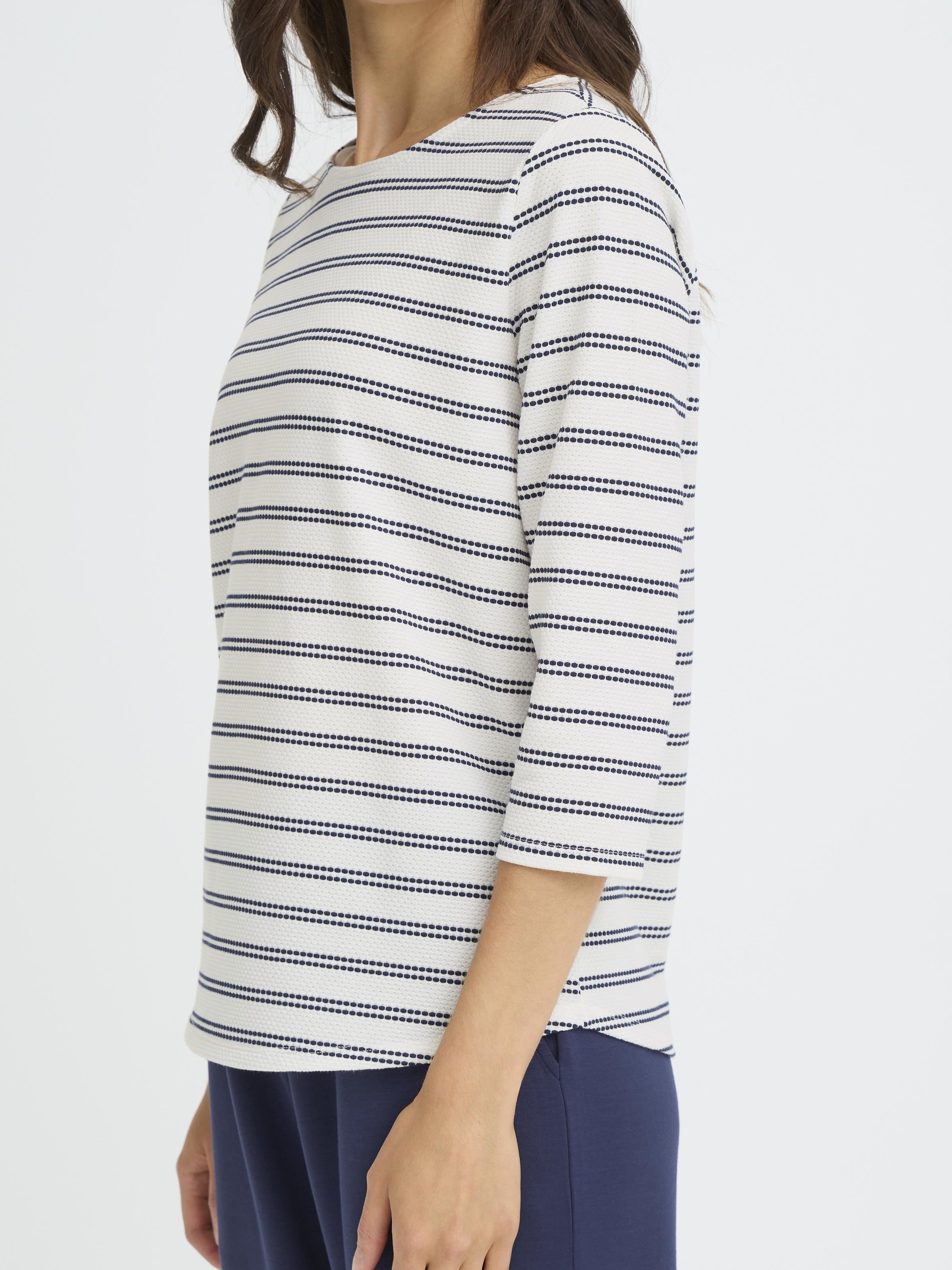 Fransa Josie Striped Three-Quarter Sleeve Crew Neck Top in off-white with navy stripes, styled with navy pants.