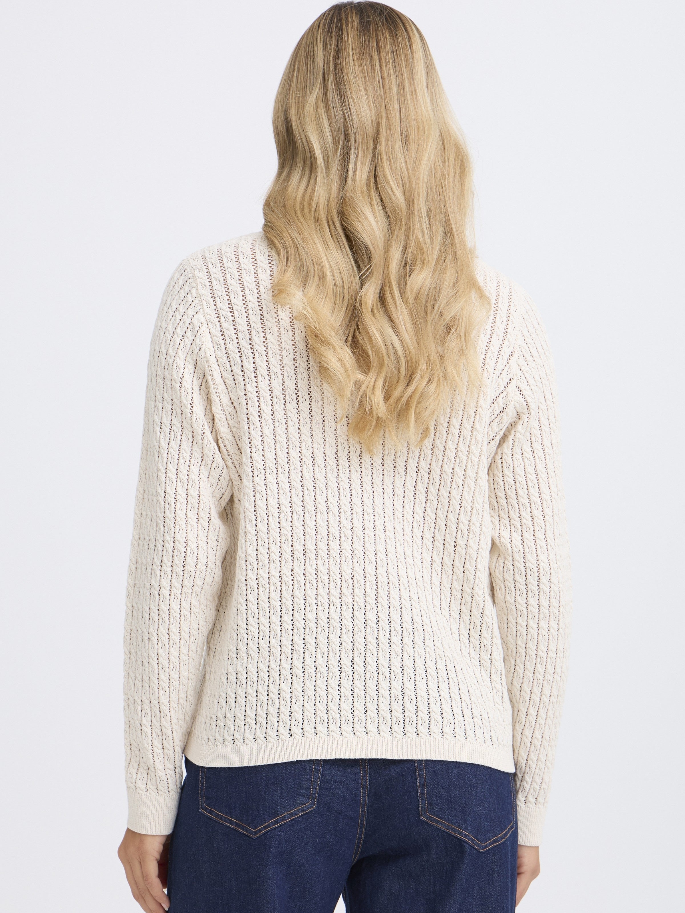 Back view of Fransa Sammy Mini Cable Knit Crew Neck Sweater in cream, paired with dark denim jeans by Fransa.