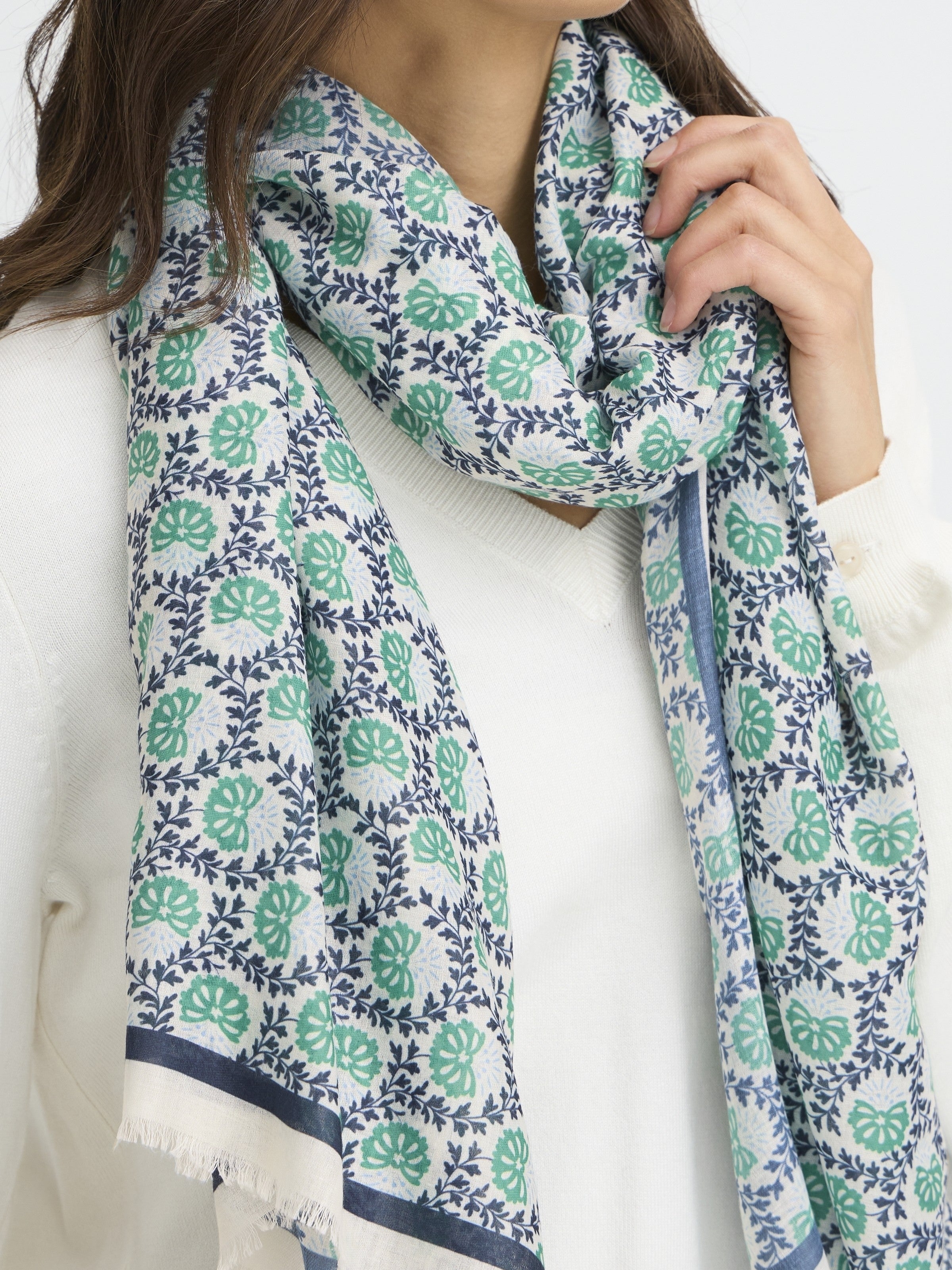 Fransa Sanni Shell Print Lightweight Scarf in green and navy floral pattern styled with white sweater accessories