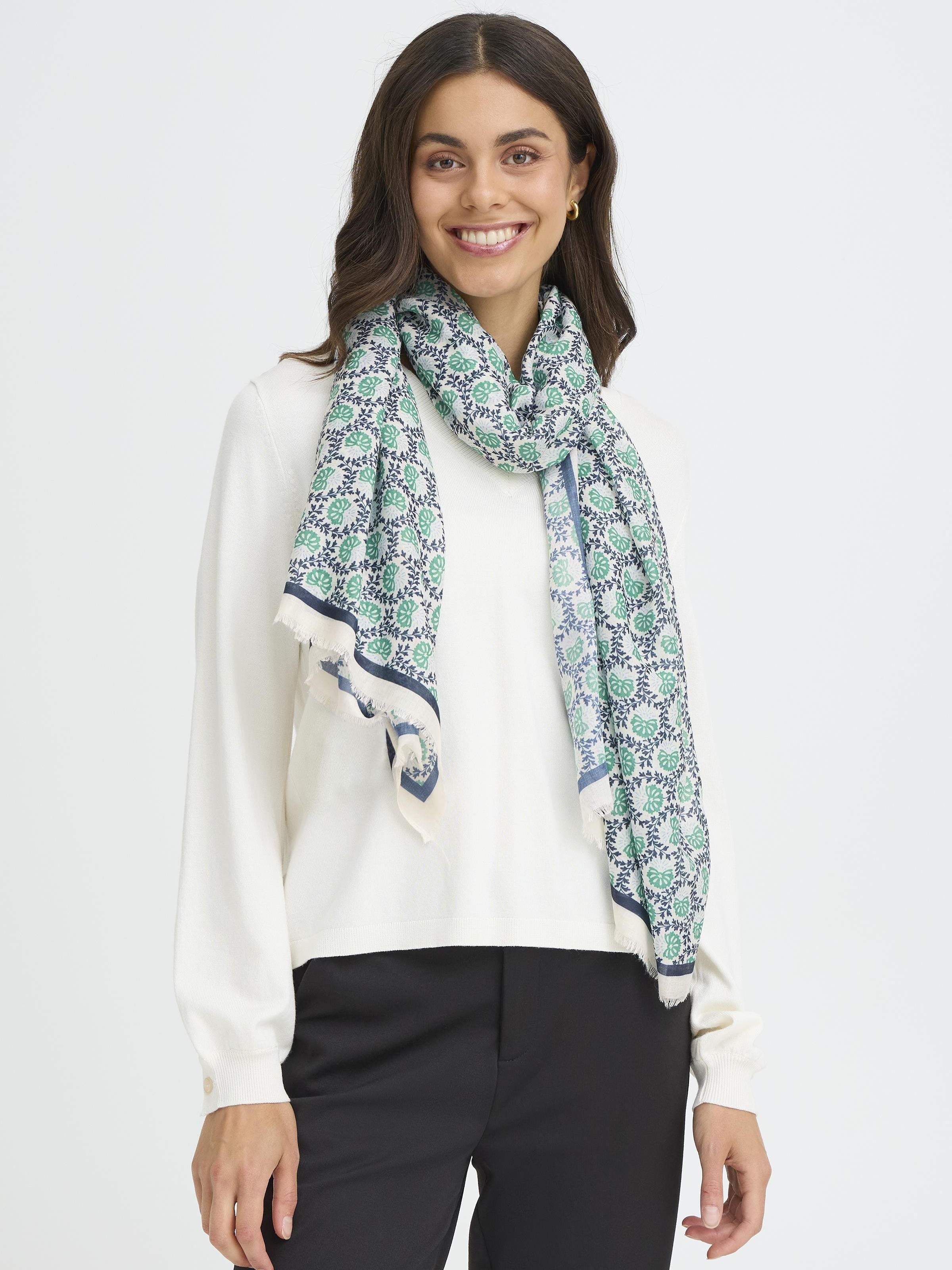 Fransa Sanni Shell Print Lightweight Scarf in blue and green shell pattern styled with white top and black pants by Fransa.