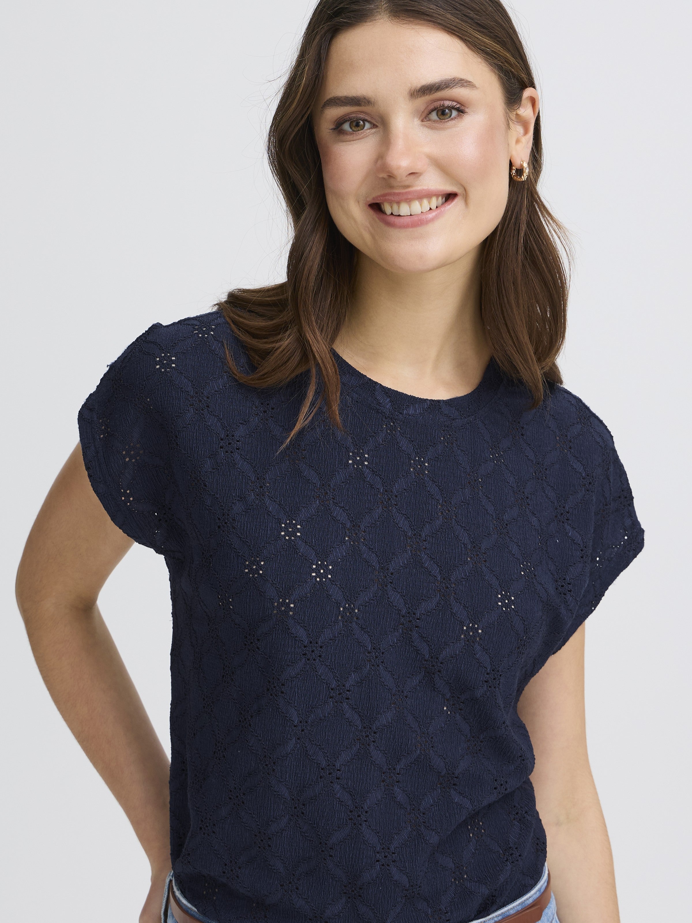 Fransa Mira Eyelet Stretch Short Sleeve Top in navy blue with delicate eyelet pattern, styled by Fransa brand.