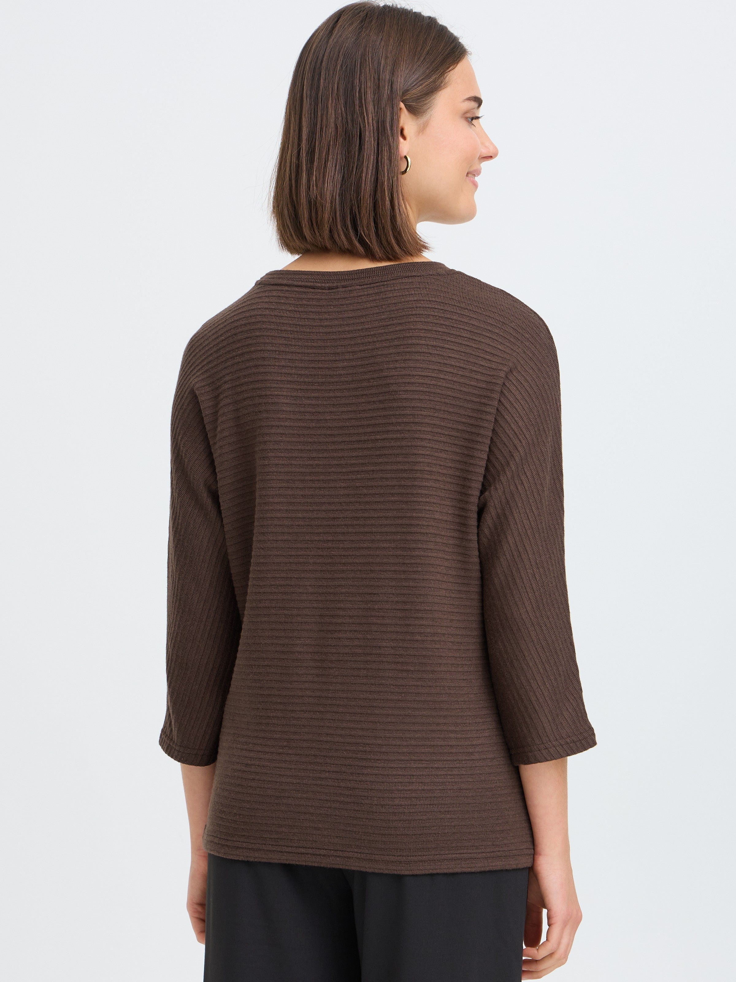 Back view of a brown ribbed long-sleeve top with a round neckline and relaxed fit.