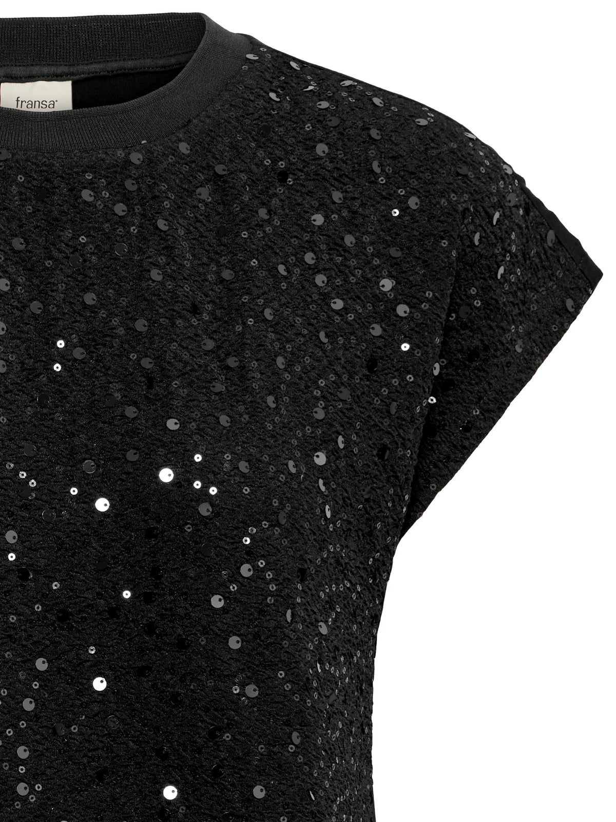 Close-up of a black short-sleeve top covered in shimmering sequins