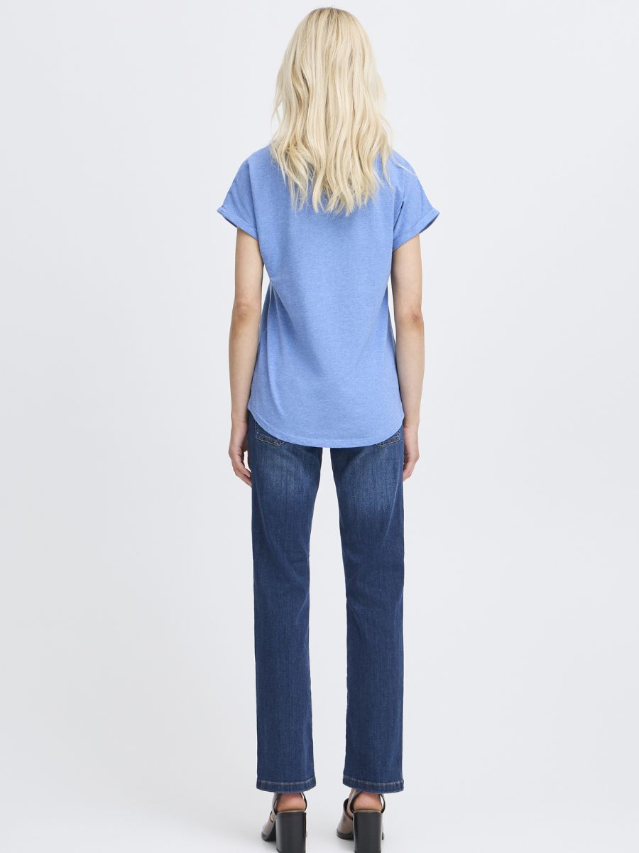 Back view of a person wearing a blue B. Young Pamila Basic T-Shirt paired with dark denim jeans by B. Young.
