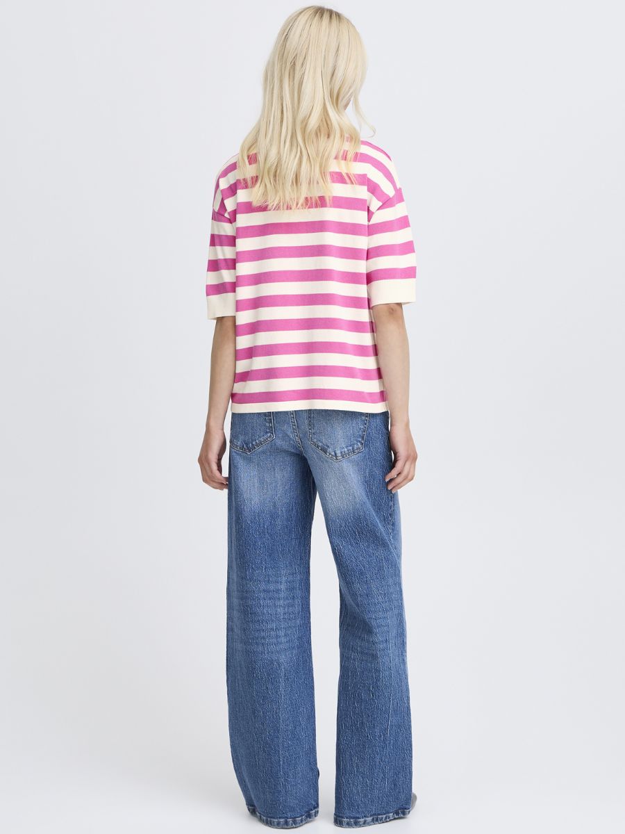 Back view of a striped pink and white B. Young Morla Stripe Short Sleeve Crew Top paired with blue denim jeans by B. Young.