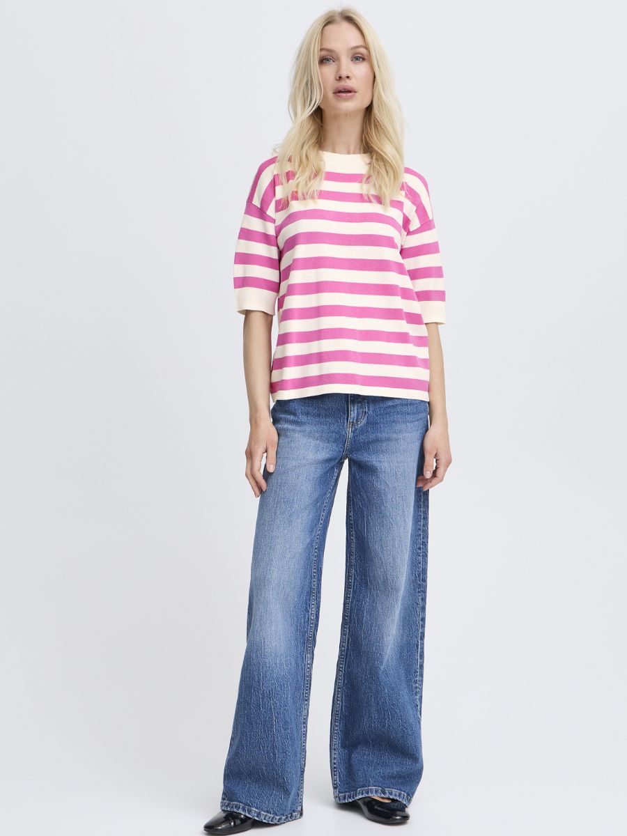B. Young Morla Stripe Short Sleeve Crew Top with pink and cream stripes, styled with wide-leg denim and black shoes.