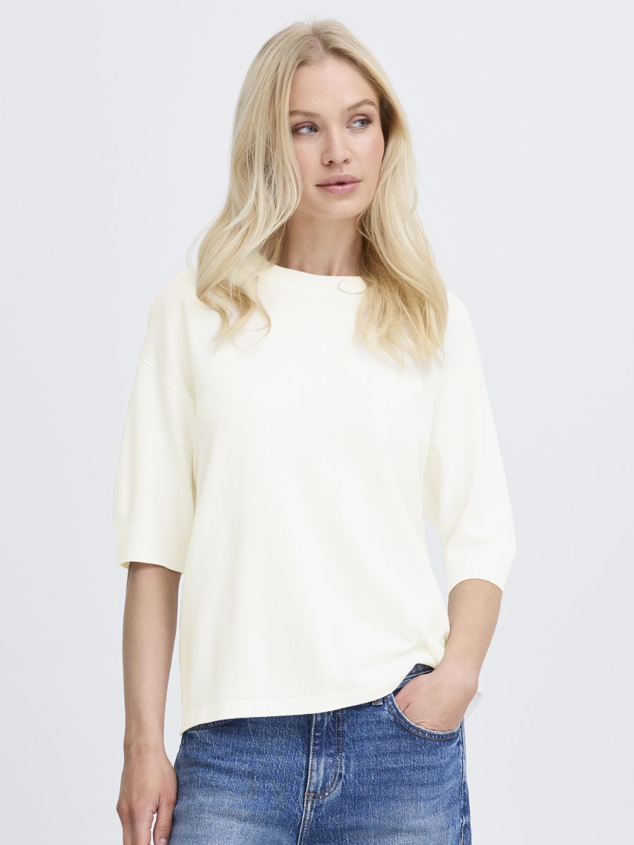 B. Young Morla Short Sleeve Crew Top in white, styled with casual denim, featuring a relaxed fit and crew neckline.