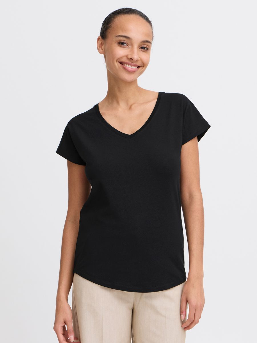 Black B. Young Pamila V-Neck Short Sleeve Tee paired with beige pants, showcasing a casual top by B. Young.