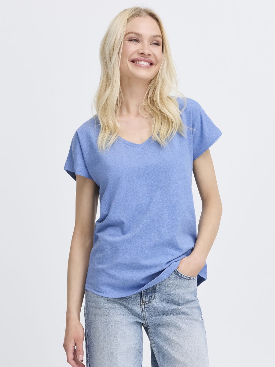 Light blue B. Young Pamila V-Neck Short Sleeve Tee paired with casual light-wash denim jeans by B. Young.