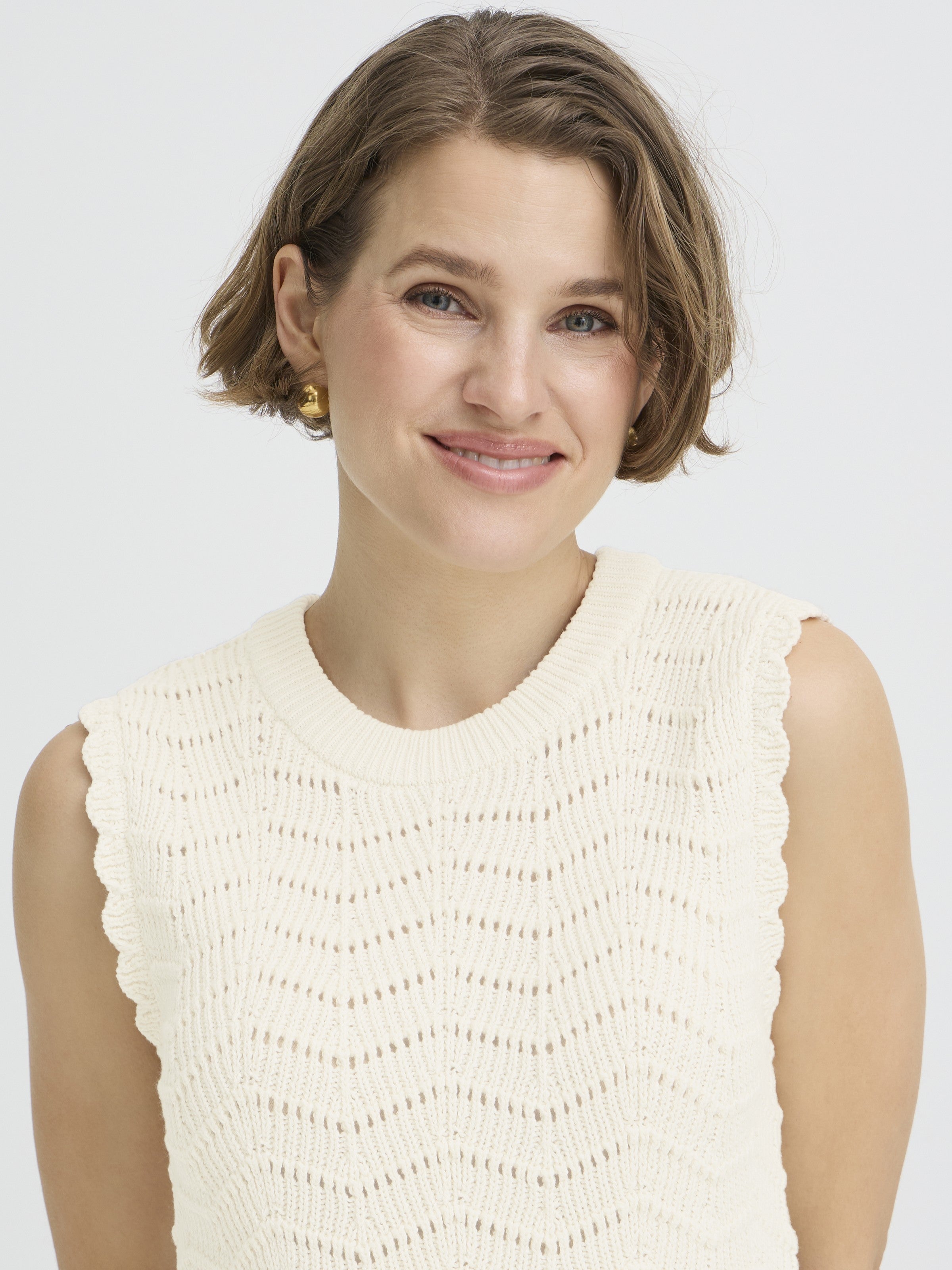 B. Young Nero Cotton Sleeveless Crew Neck Knit Top in beige, detailed with scalloped edges and textured knit by B. Young.
