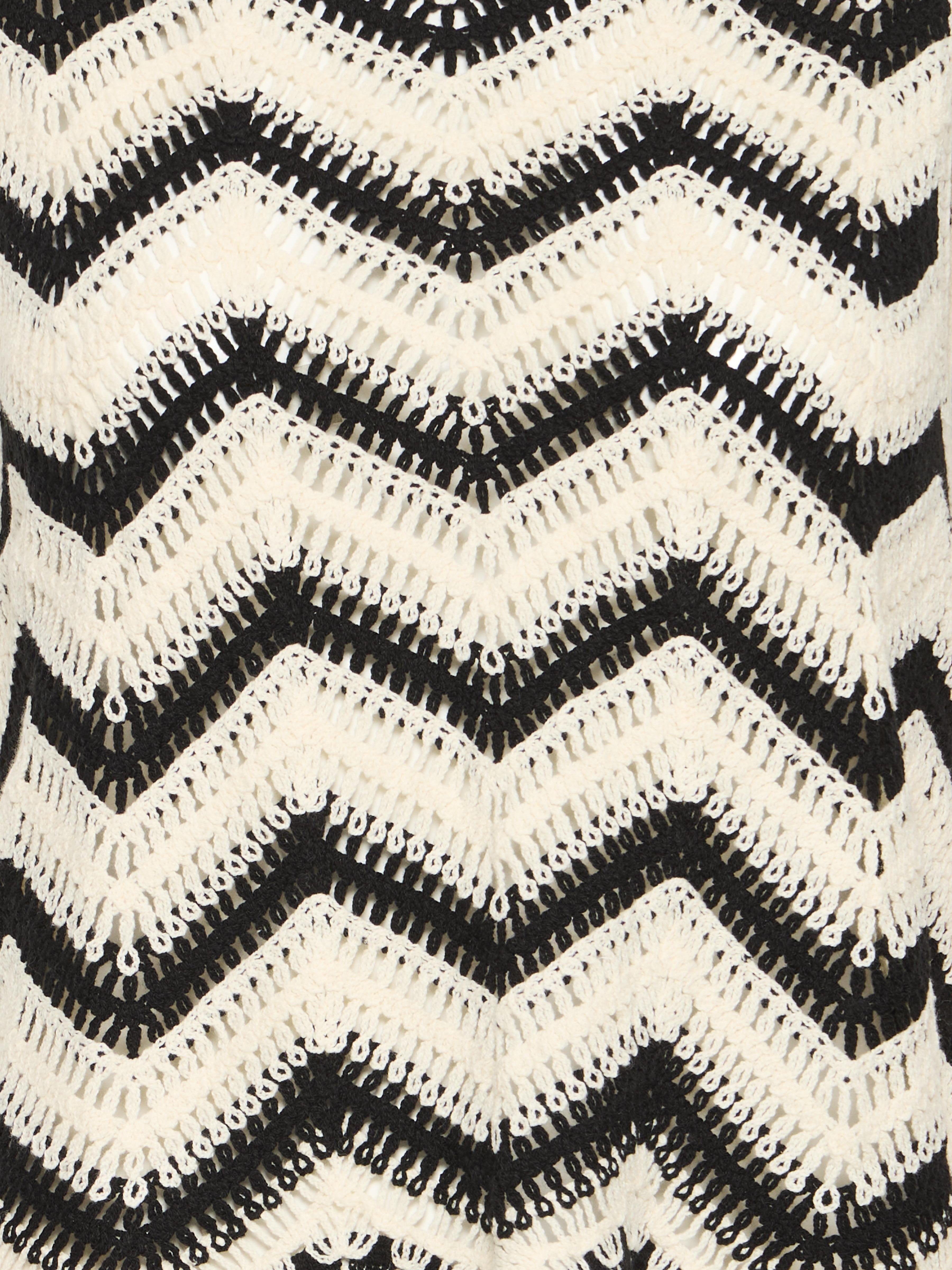 Close-up of black and beige crochet pattern on B. Young Crochet Cotton Top by B. Young.