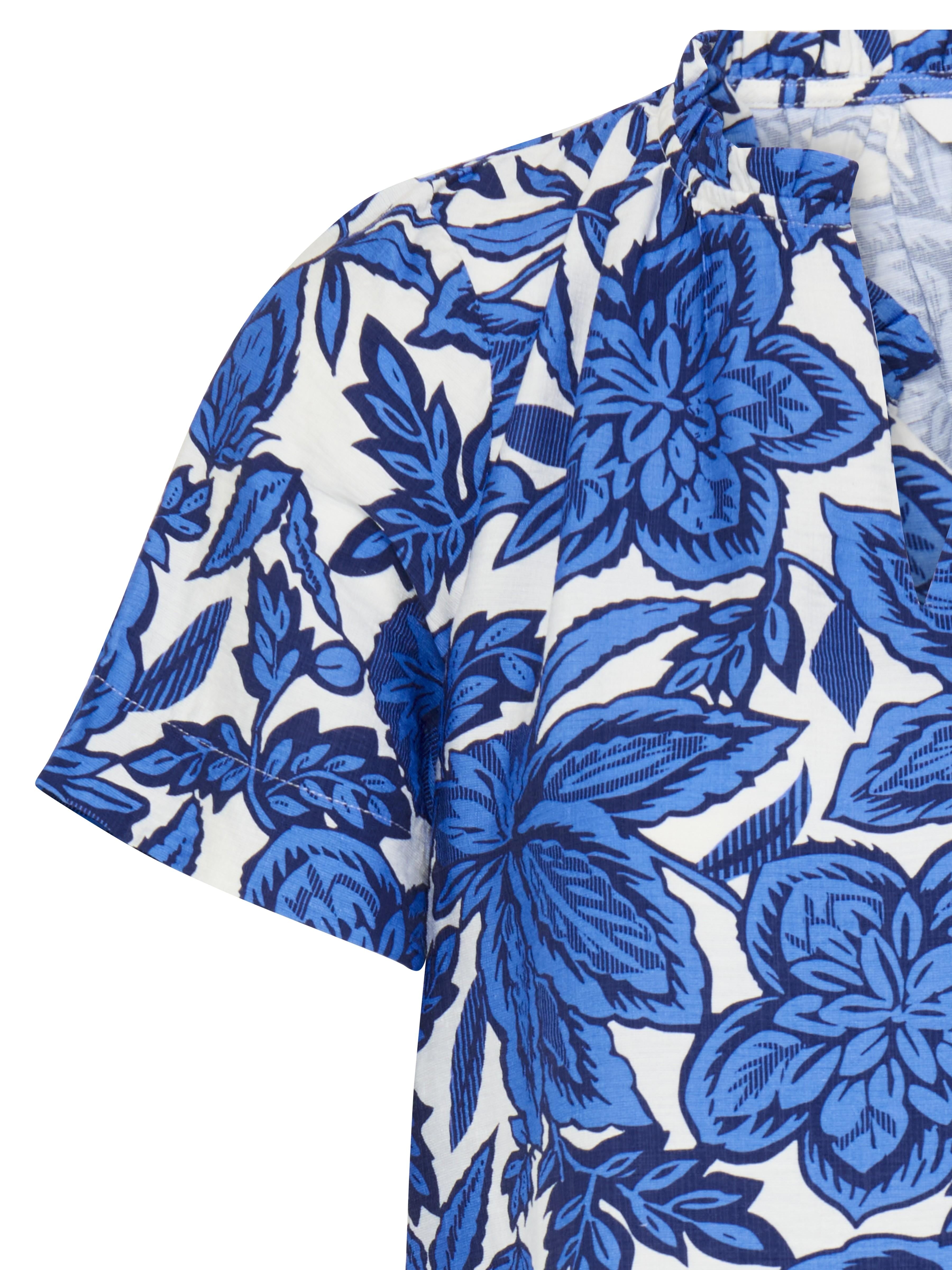 B. Young Ikaia Ruffle Short Sleeve Top in blue and white floral pattern, designed by B. Young, suitable as a top.