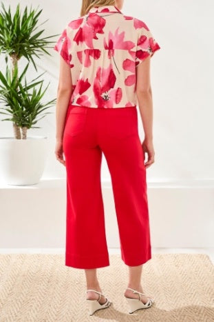 Back view of Tribal Mesmer Beauty Tie-Front Blouse in pink floral paired with red cropped pants by Tribal Sportswear Inc.