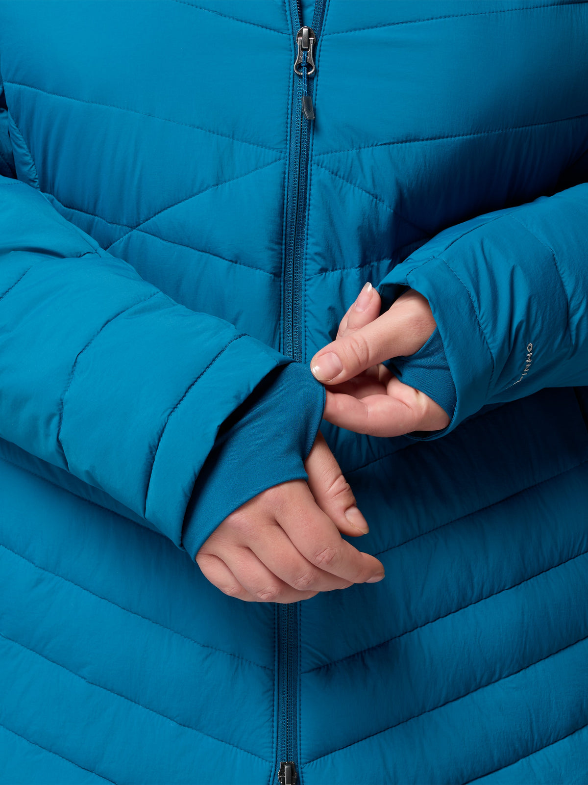 Blue quilted puffer jacket with a front zipper and extended sleeve cuffs