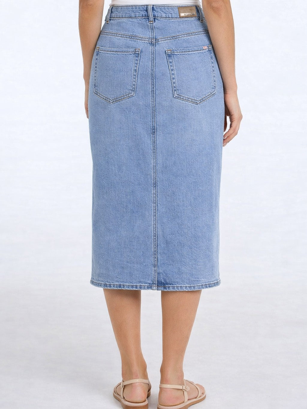 Light blue Lois Leila Front Slit 29" Denim Skirt with back pockets, styled by Lois, shown from the rear view.
