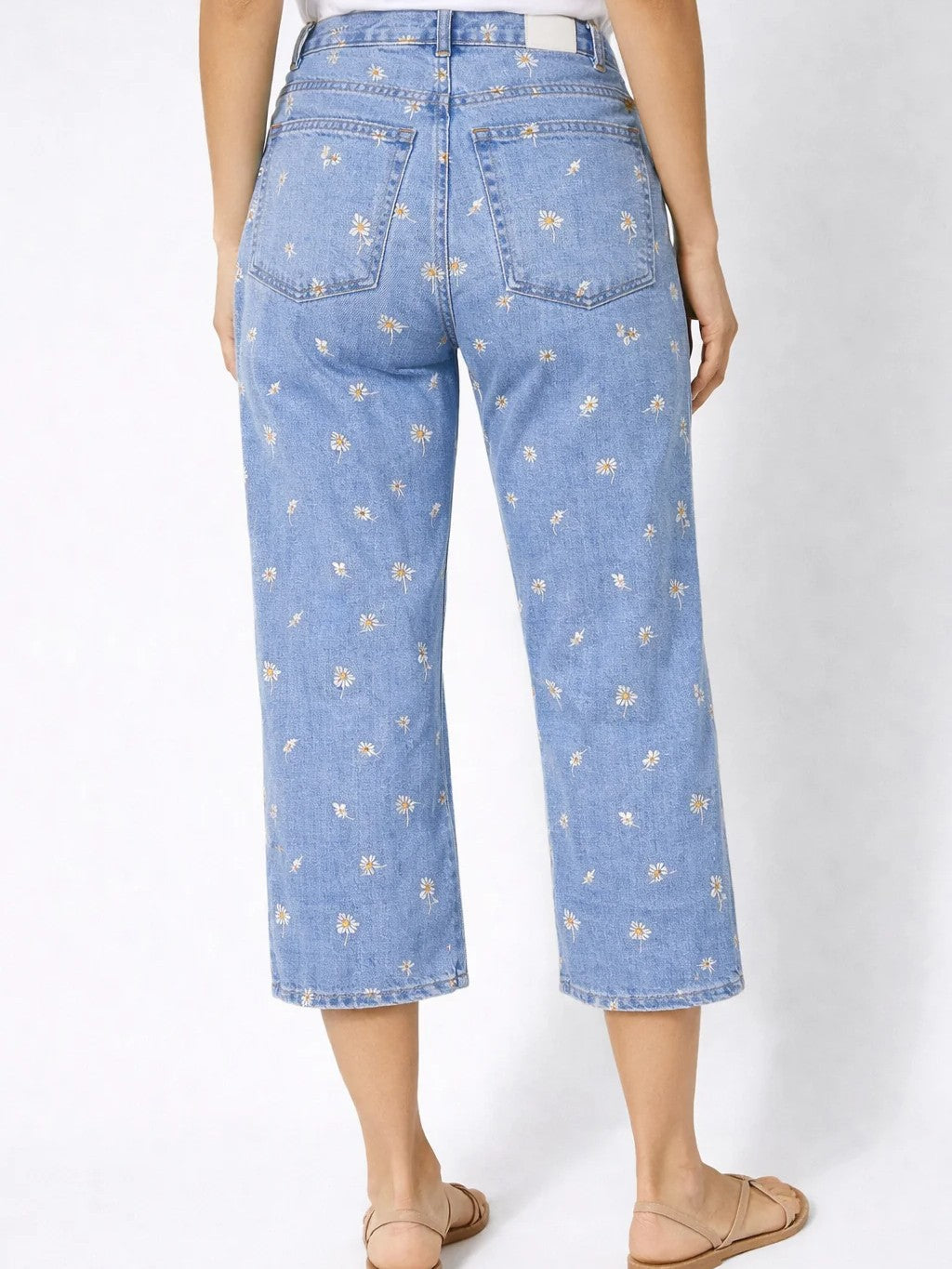 Lois Denim Gigi Daisy Embroidered 25 Inch Crop Jeans with light blue denim and floral embroidery detail.