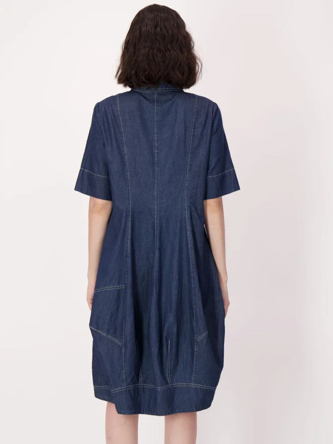 Back view of a loose-fitting, knee-length denim dress with short sleeves and visible stitching details.