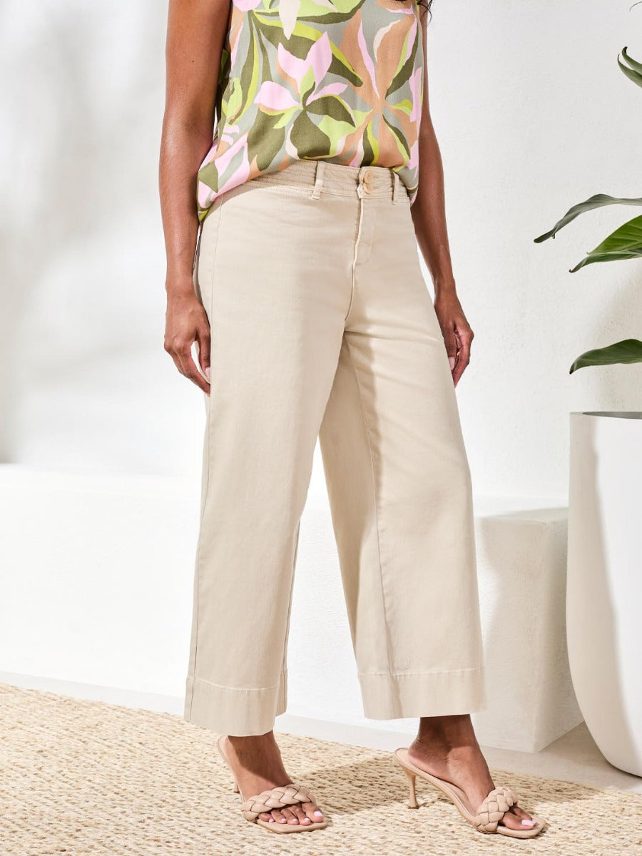 Tribal Comfort Fit 26" Palazzo Denim Pants in tan by Tribal Sportswear Inc., styled with a floral top and sandals