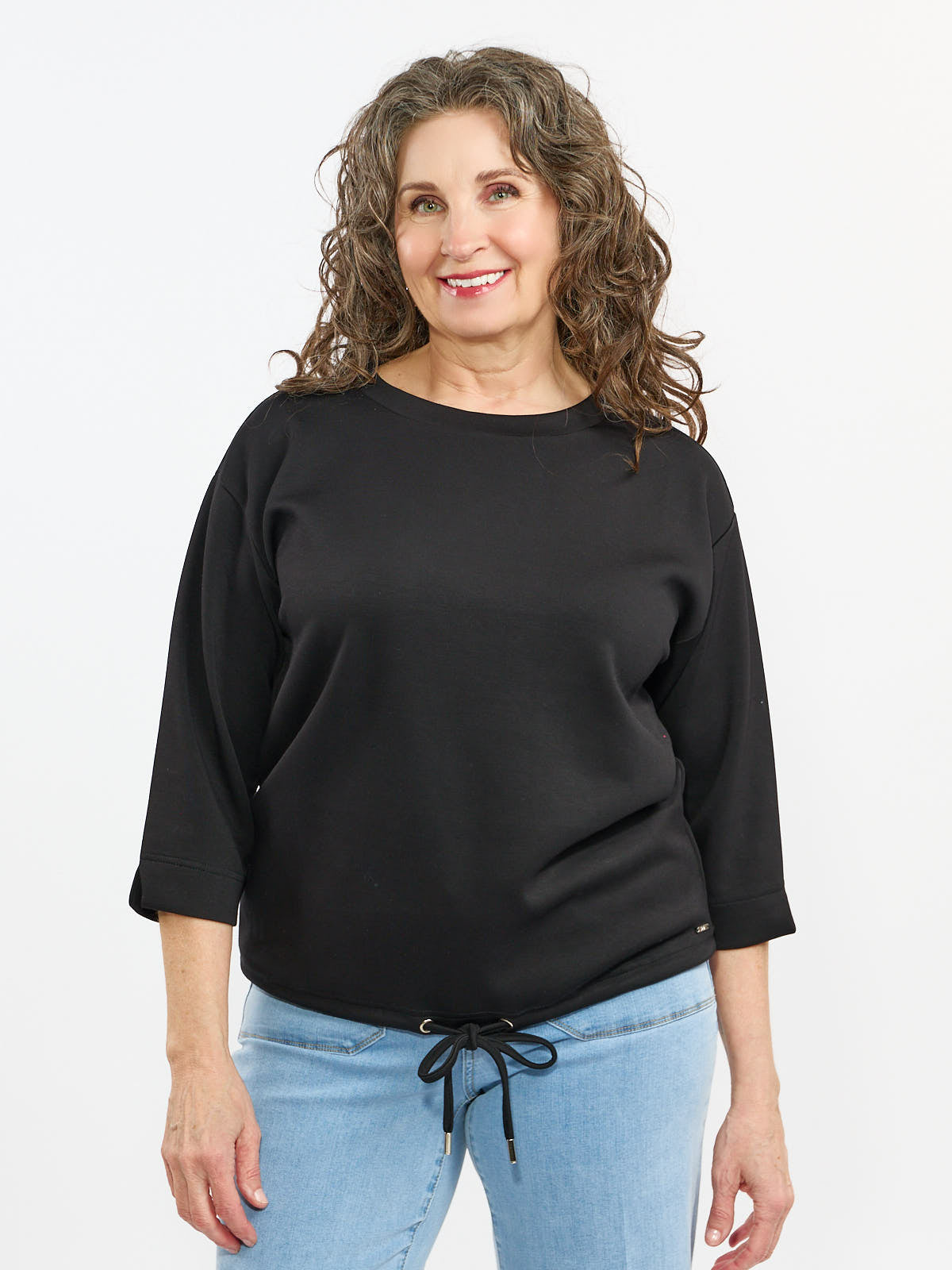 Lois Janelle Modal 3/4 Sleeve Tie Waist Top in black, styled casually with light blue denim jeans.