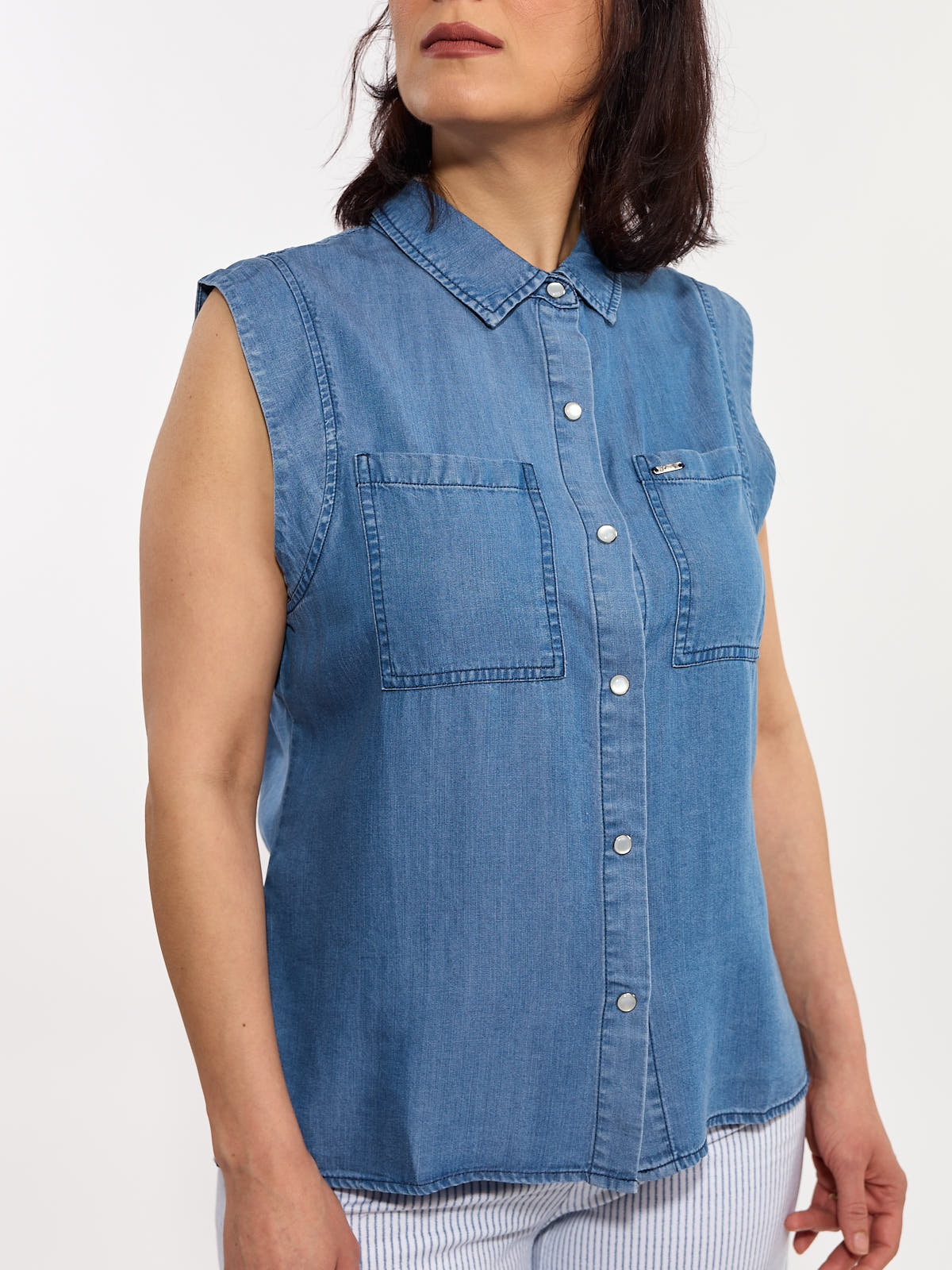 Lois Edith Tencel Button Front Sleeveless Top in blue denim with front pockets and pearl buttons by Lois
