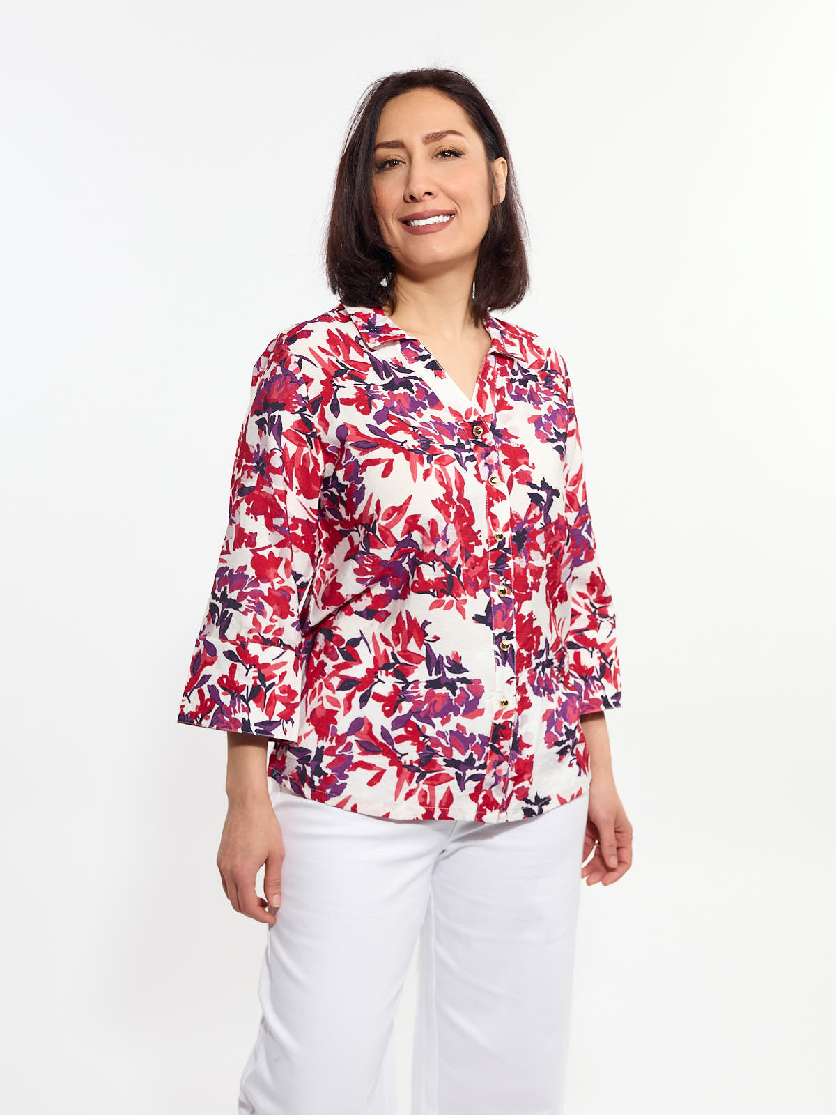 Lois Melina Floral 3/4 Sleeve Button V-Neck Blouse with red and purple floral print, styled with white pants