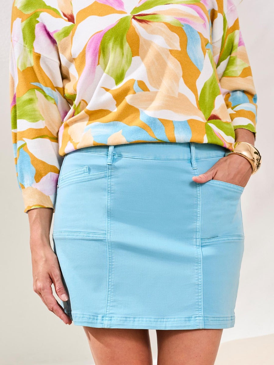 Light blue Tribal Essential 17" Pull-On Colored Denim Skort paired with colorful floral sweater by Tribal Sportswear Inc.