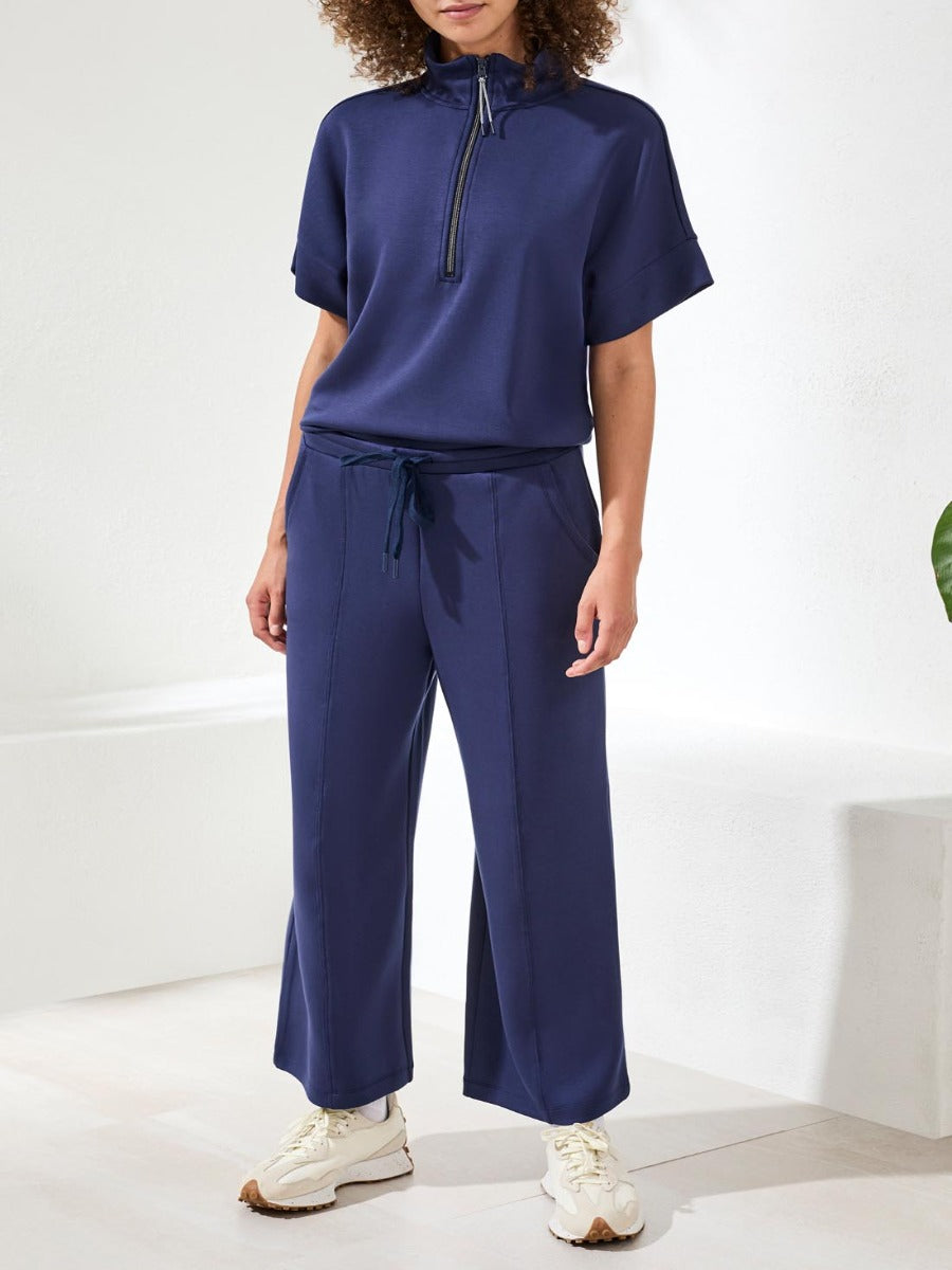 Tribal Techno Lux Tie-Waist Crop 26" Pants in navy blue by Tribal Sportswear Inc. styled with casual footwear