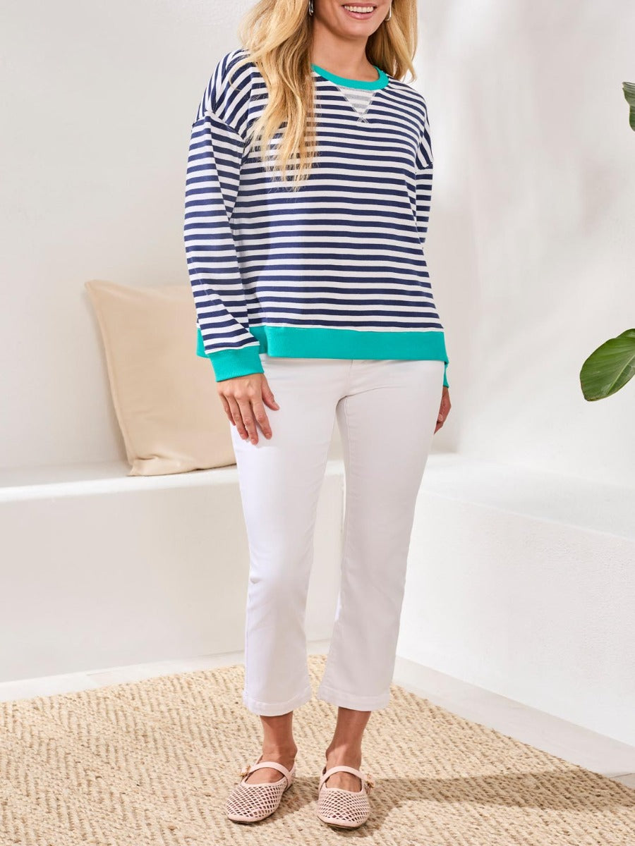Tribal Freed Classic Stripe Crew Sweater from Tribal Sportswear Inc. in navy and white with teal accents, styled with white pants.