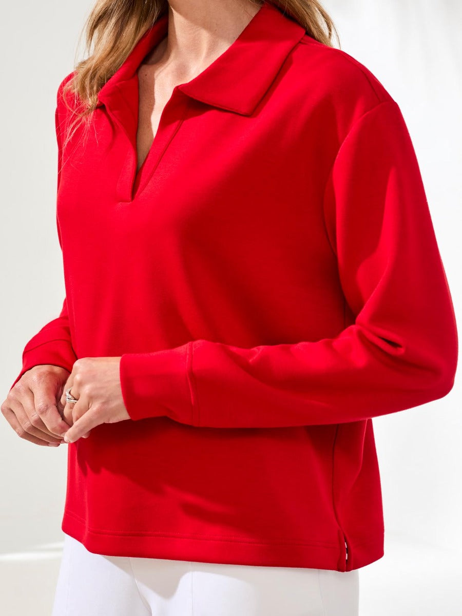 Red long-sleeve Tribal Techno Lux Playful V-Neck Top by Tribal Sportswear Inc. with a relaxed collar and cuff details.