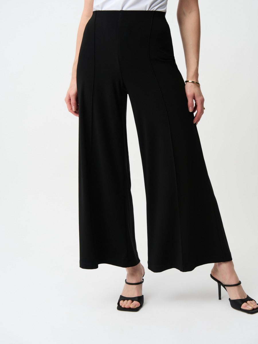 Joseph Ribkoff Polish Silky Knit 28" Wide Pant in black paired with open-toe heeled sandals by Joseph Ribkoff