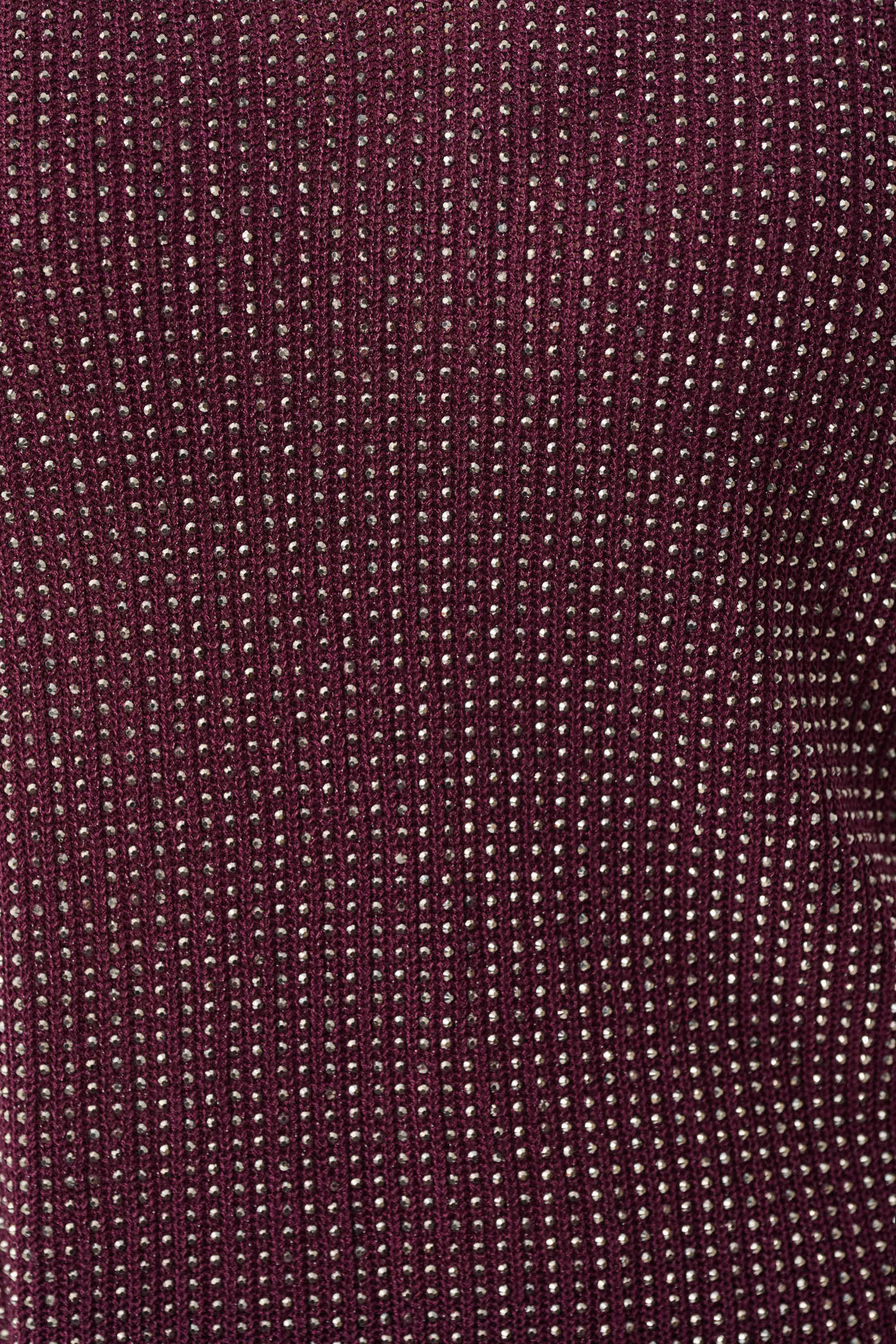 Close-up of burgundy knit fabric with metallic accents from Joseph Ribkoff Dazzle Metallic Knit Top showcasing texture and shimmer.