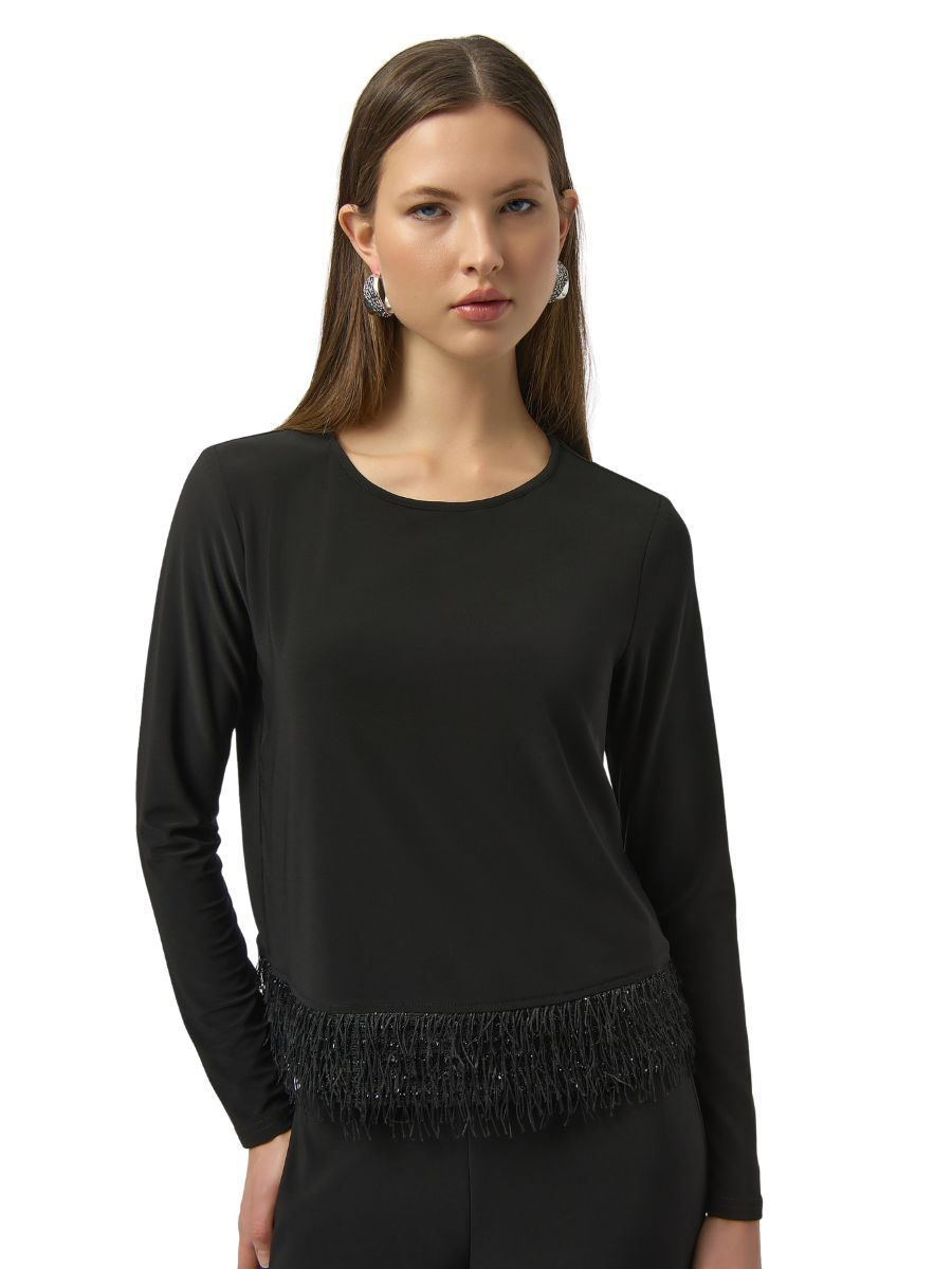 Black long sleeve top with fringe detail by Joseph Ribkoff Flair & Fringe Top, styled with silver earrings.