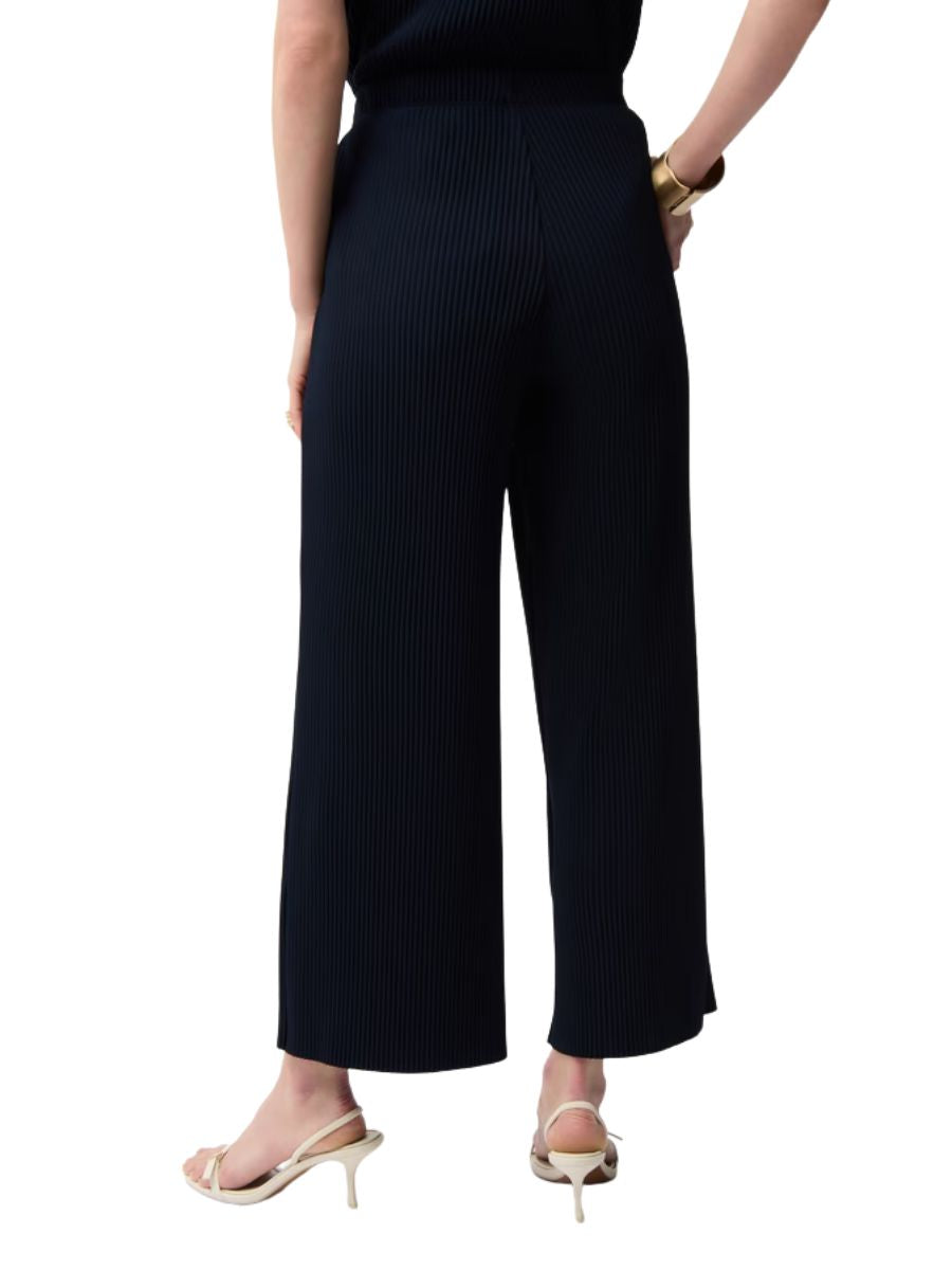 Back view of Joseph Ribkoff Crepe Pleated Pull-On 27" Pant in navy with wide leg and pleated texture by Joseph Ribkoff.