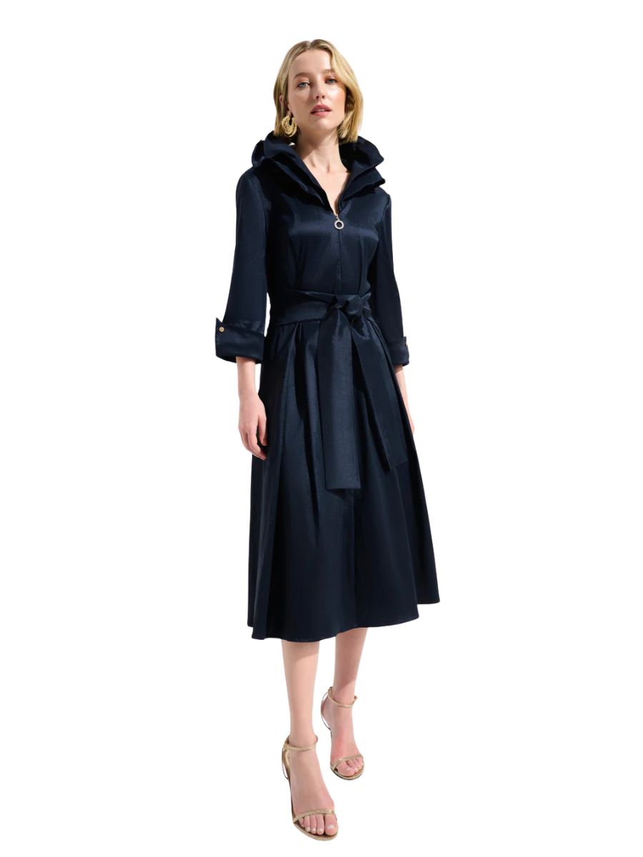 Navy blue belted trench coat with rolled sleeves and a hood, paired with gold open-toe heels.