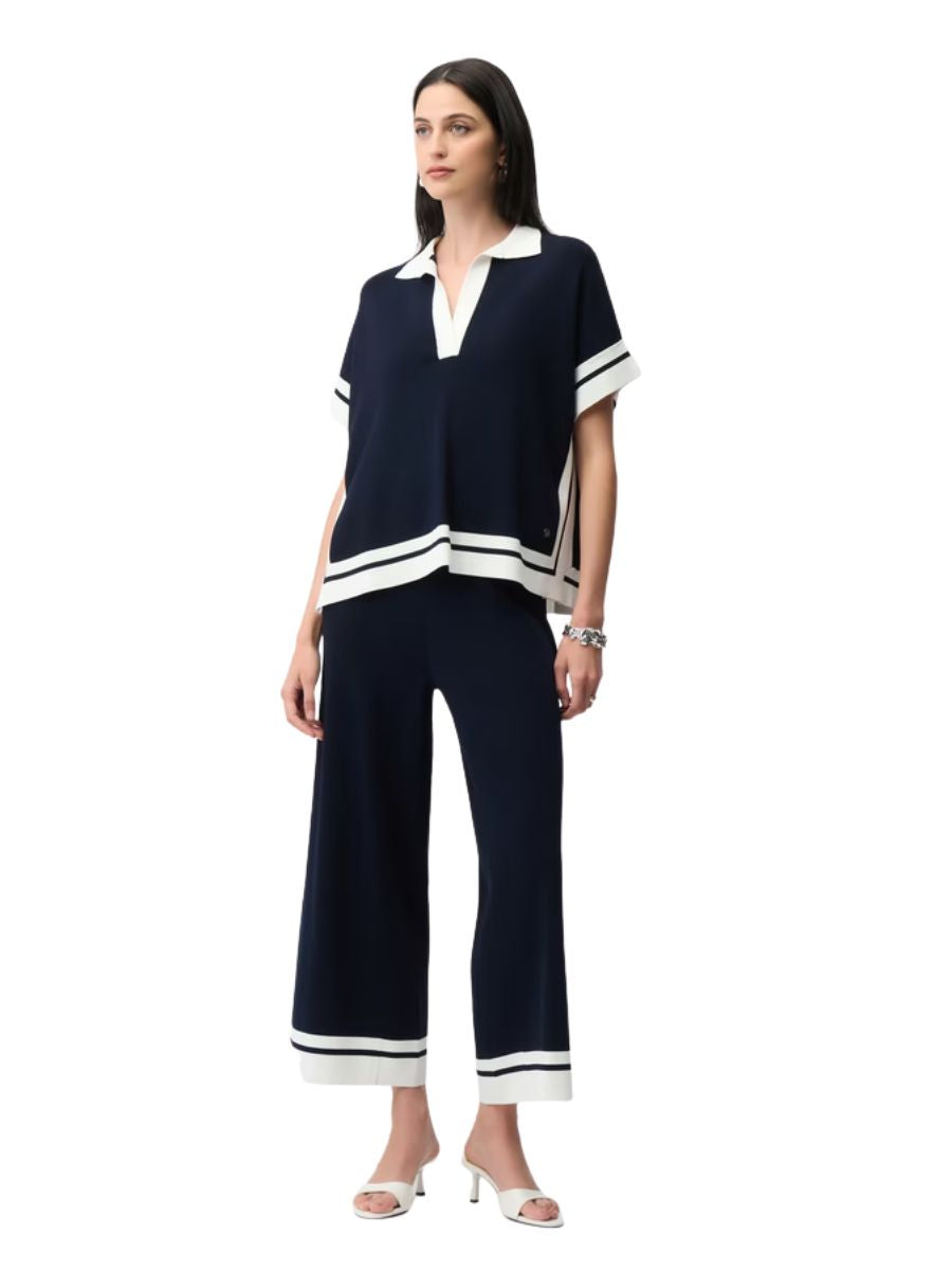 Slim fit navy knit pants with white border hem detail from Joseph Ribkoff paired with matching top and white heels