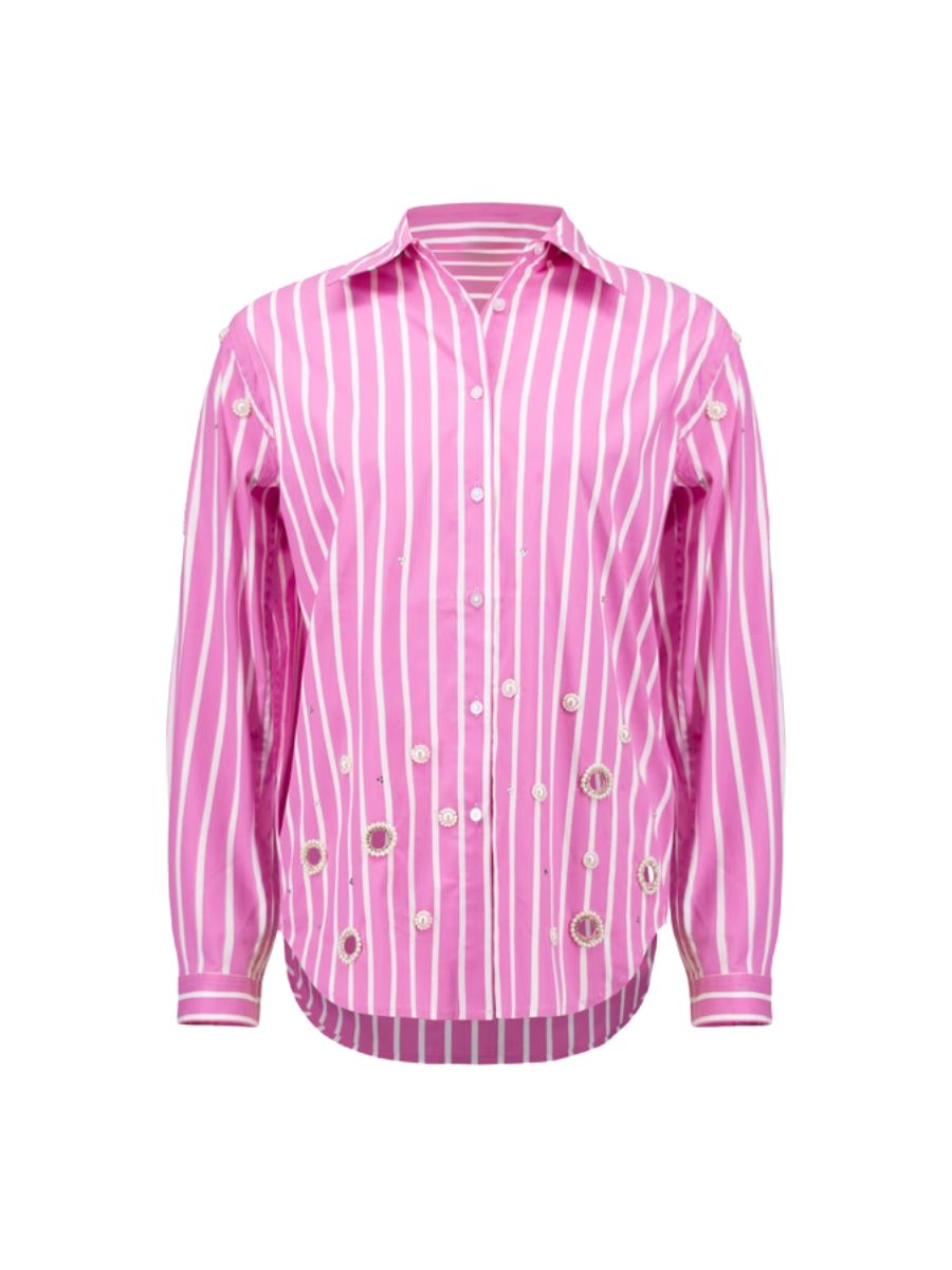 Pink and white vertical striped long-sleeve button-up top with decorative metal eyelets at the bottom front.