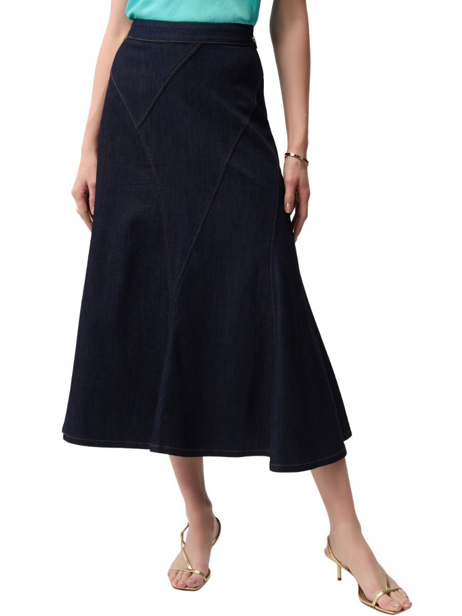 Dark blue denim A-line skirt with stitched panel details worn with a teal top and gold sandals.